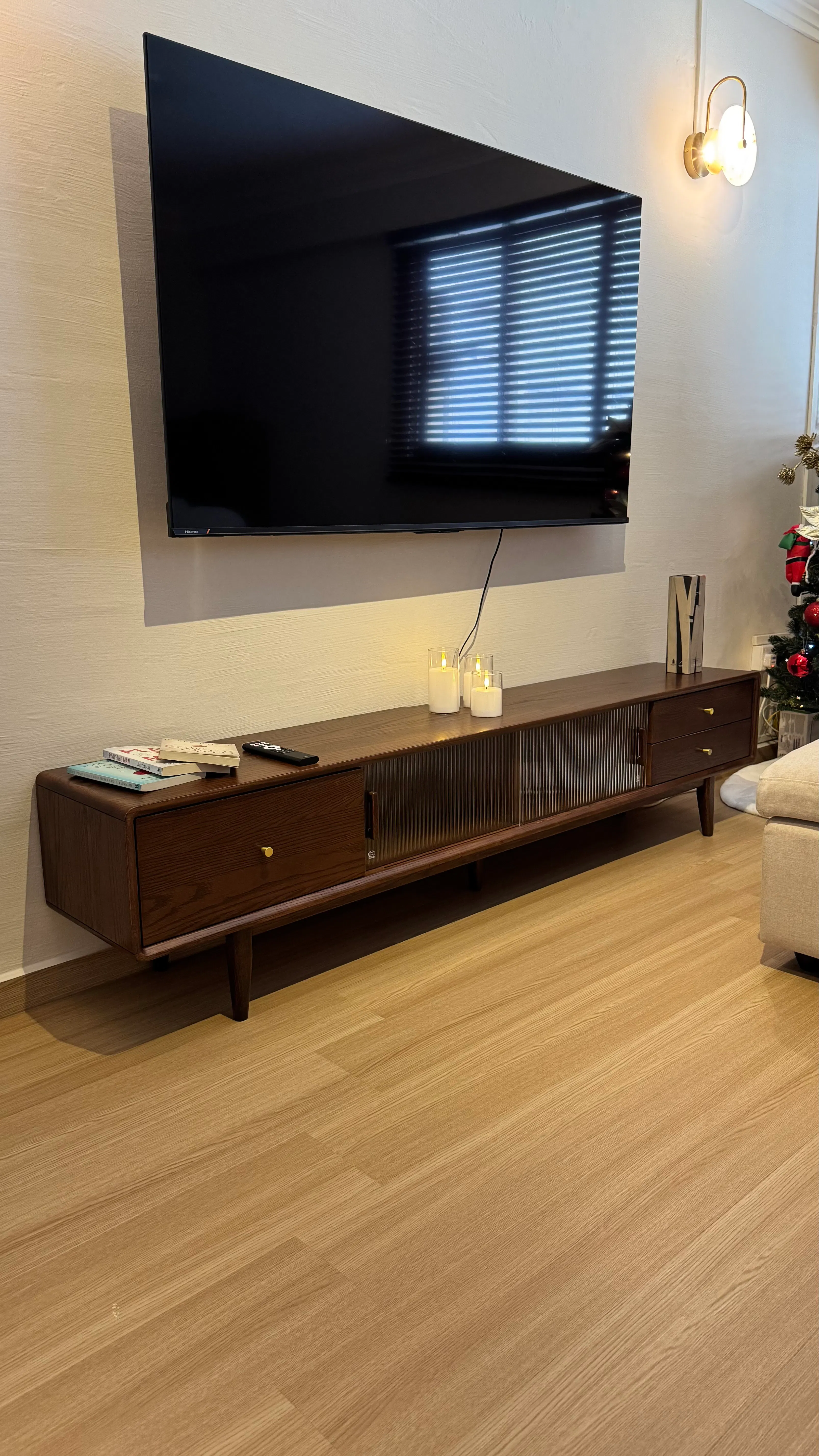 Customer home photo 1: It’s beautiful. The corners are rounded. The legs come with felt padded stickers. There are holes at the back for cable access. I was easily able to put in an entire large power extension through it. 

The quality is good, the wood is smooth and even the hardware is well-finished.