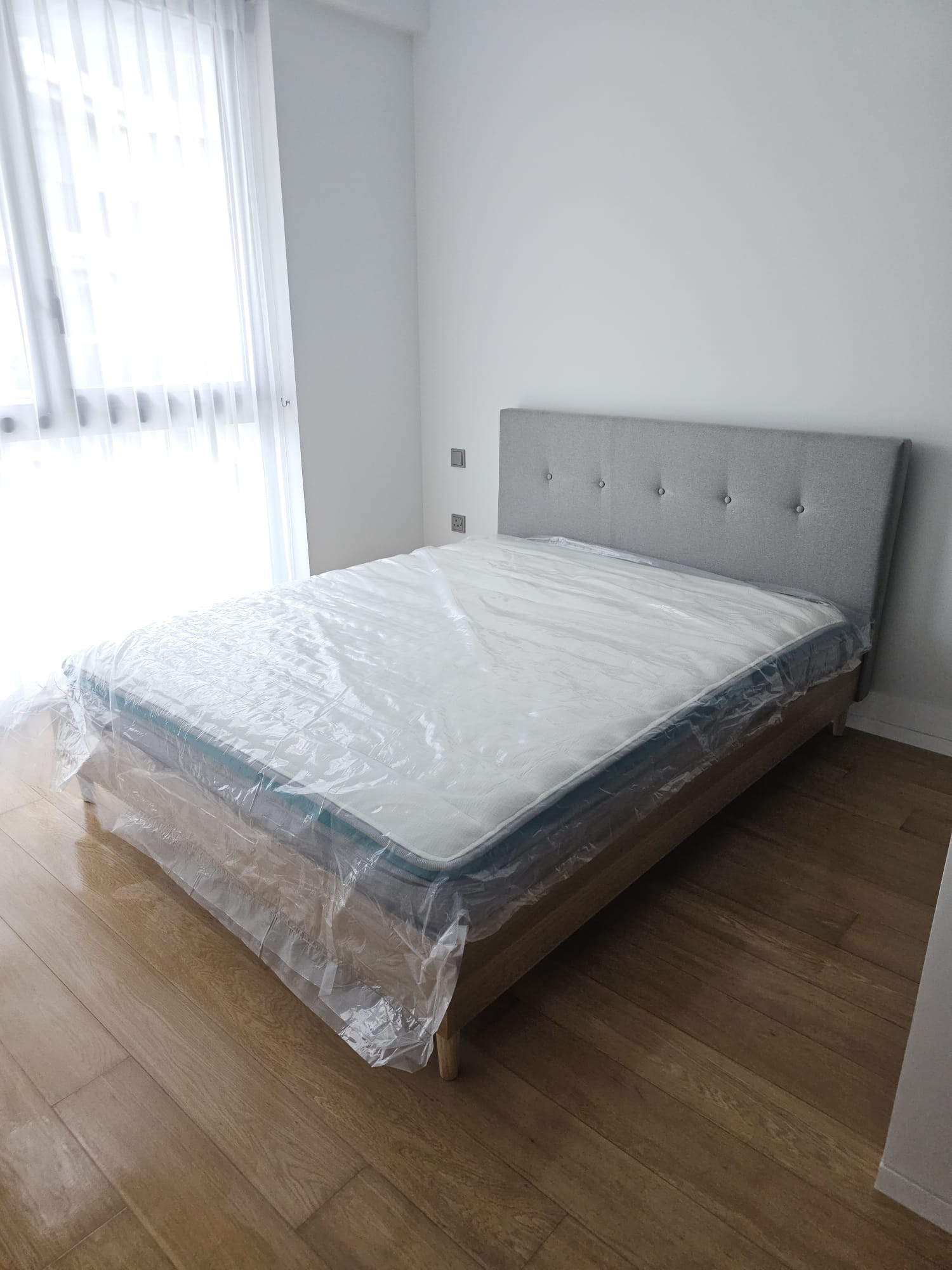 Customer home photo 1: Bedframe suit the colour theme of my bedroom. Sturdy and simple design. Fit my Queens size mattress perfectly.