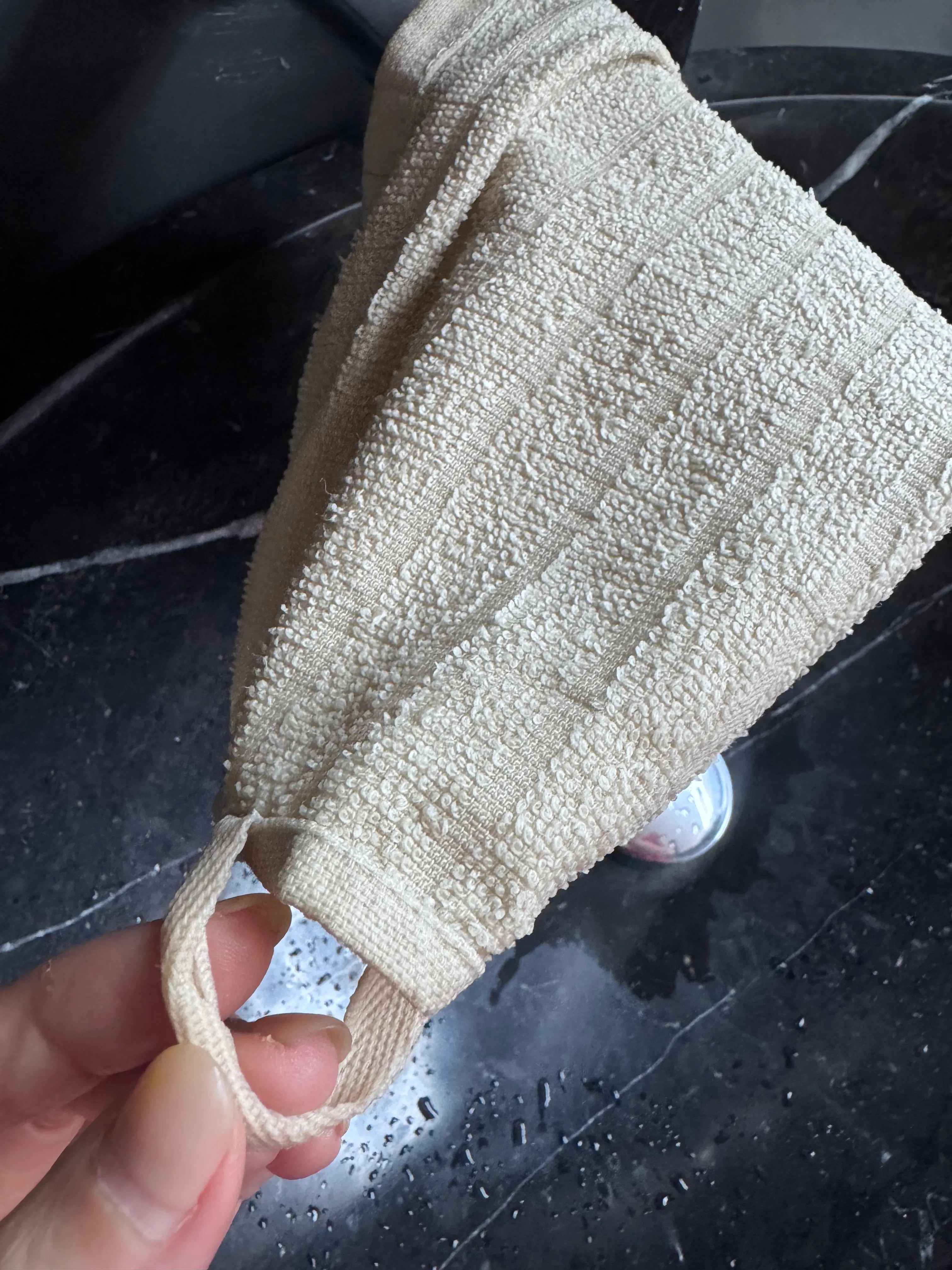 Customer home photo 1: Looks good and feels good. Has a hook as well. Bought at promo price. Abit thinner than other towels, but ok for the price.