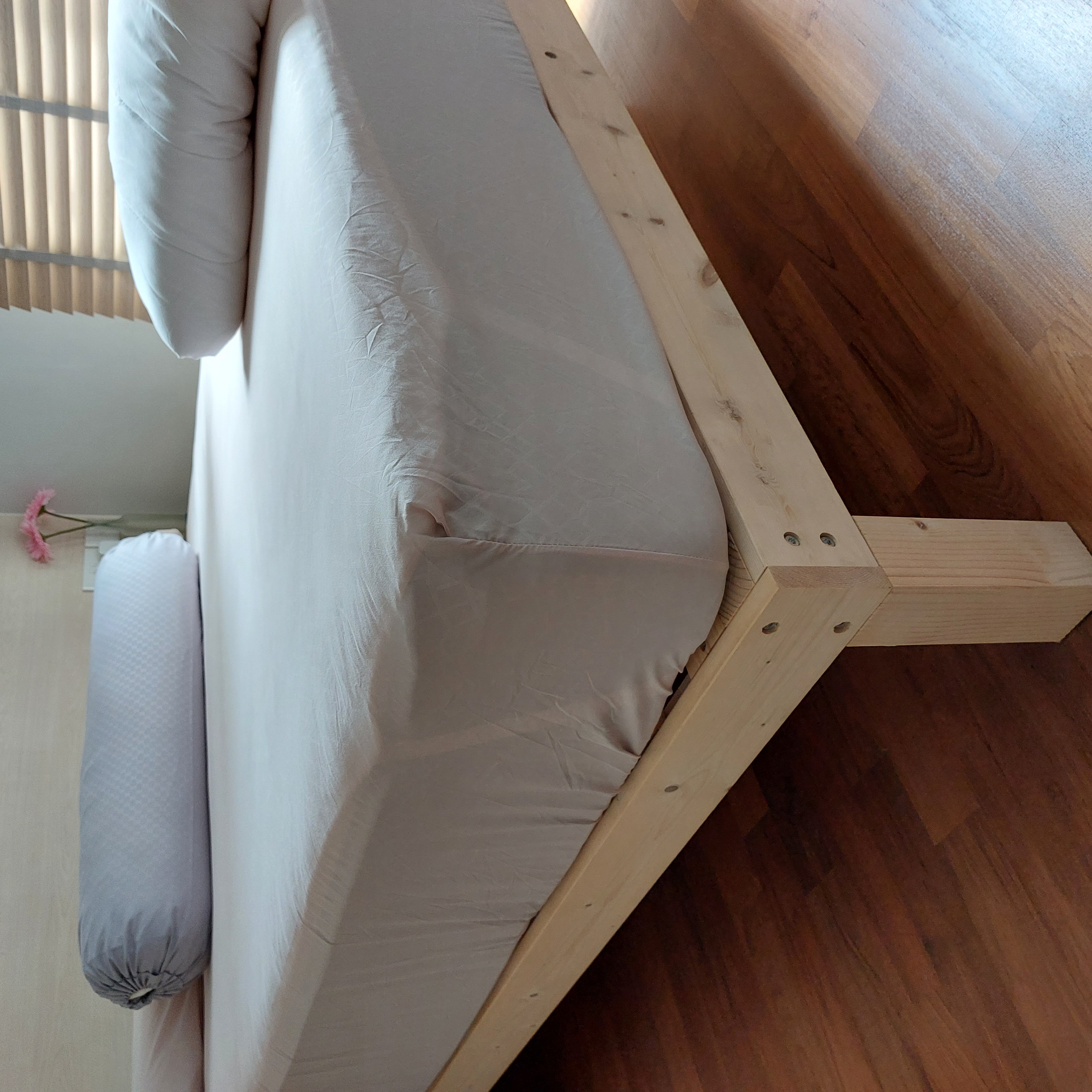 Customer home photo 8: It has been almost a year since I received and used it, I will say it is sturdy and firm. When changing the bedcover it was easy to move the bed frame.