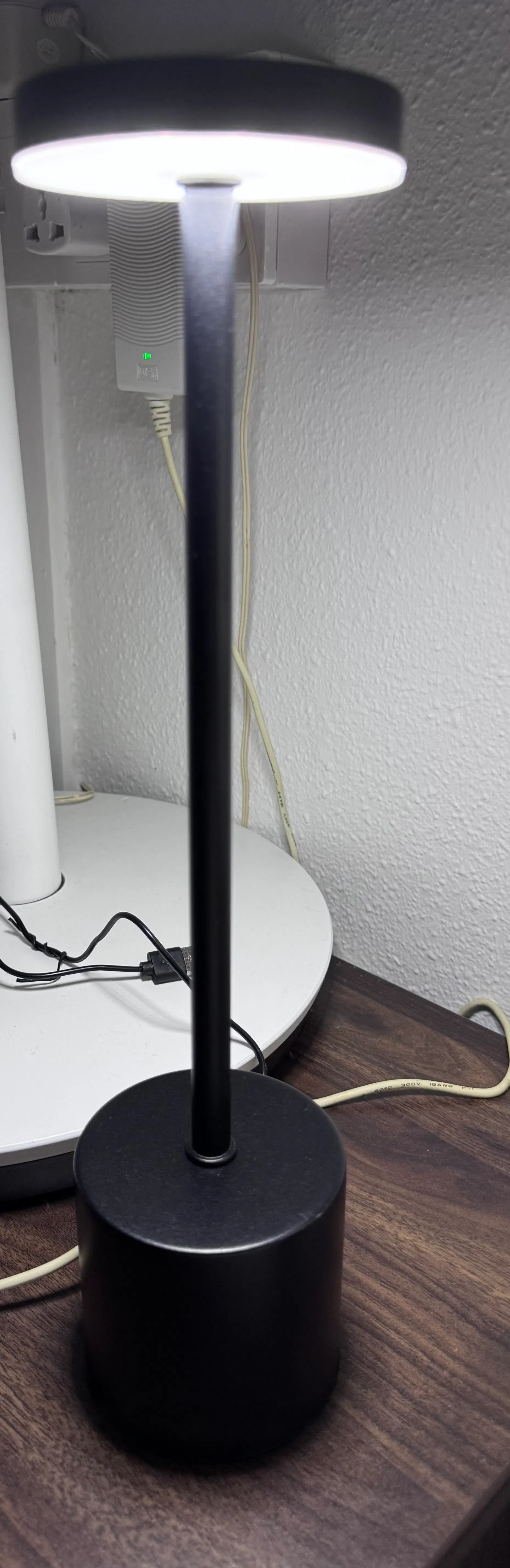 Customer home photo 1: A lightweight table lamp offering bright white illumination or a soft yellow dim glow, with light colours that switch effortlessly with a tap on the top.