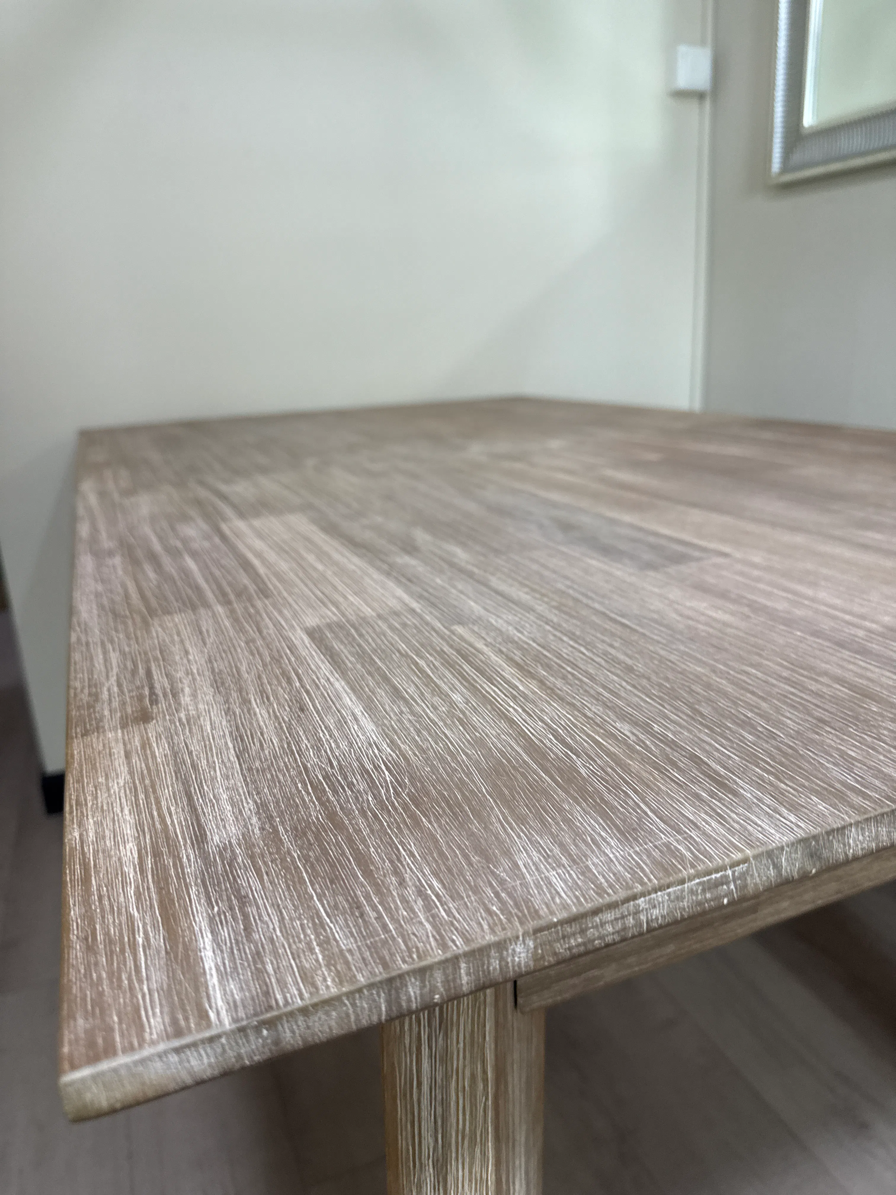 Customer home photo 2: Nice stable extendable dining table. I love the wood grain finish. Even though the table I received has a defect, customer service promptly arrange for a replacement. Excellent customer service!