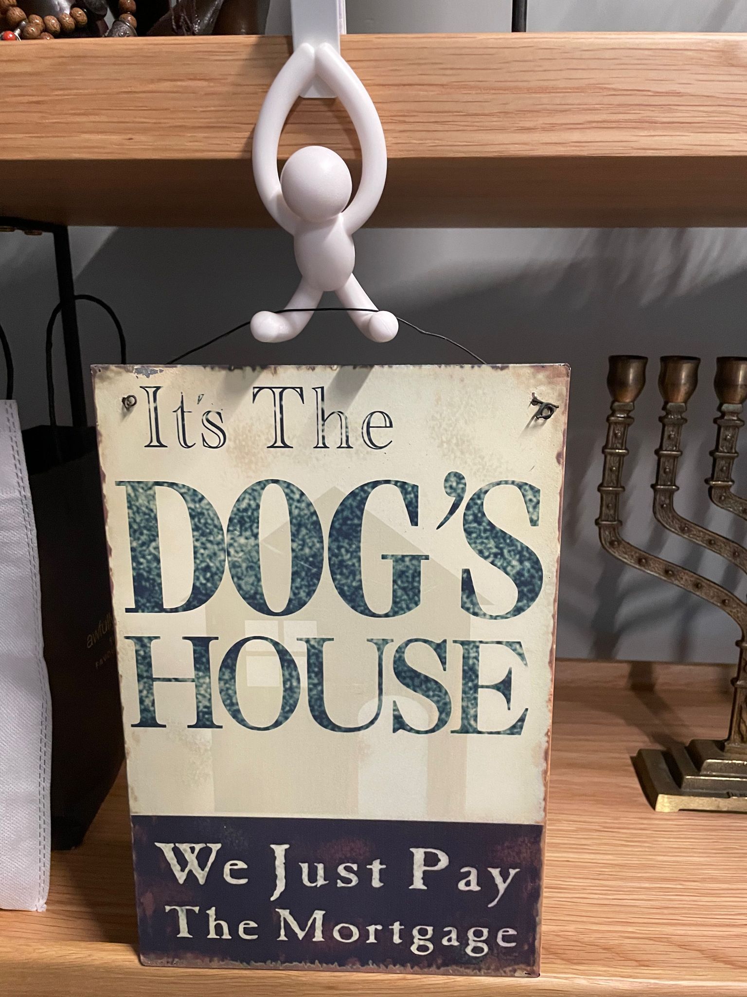 Customer home photo 3: Playful yet practical and useful as extra hooks without having to nail my wall. It would however be more helpful if the product description can include the exact dimension(s) for the hook to be placed over the cabinet doors  as not all doors are made the same.