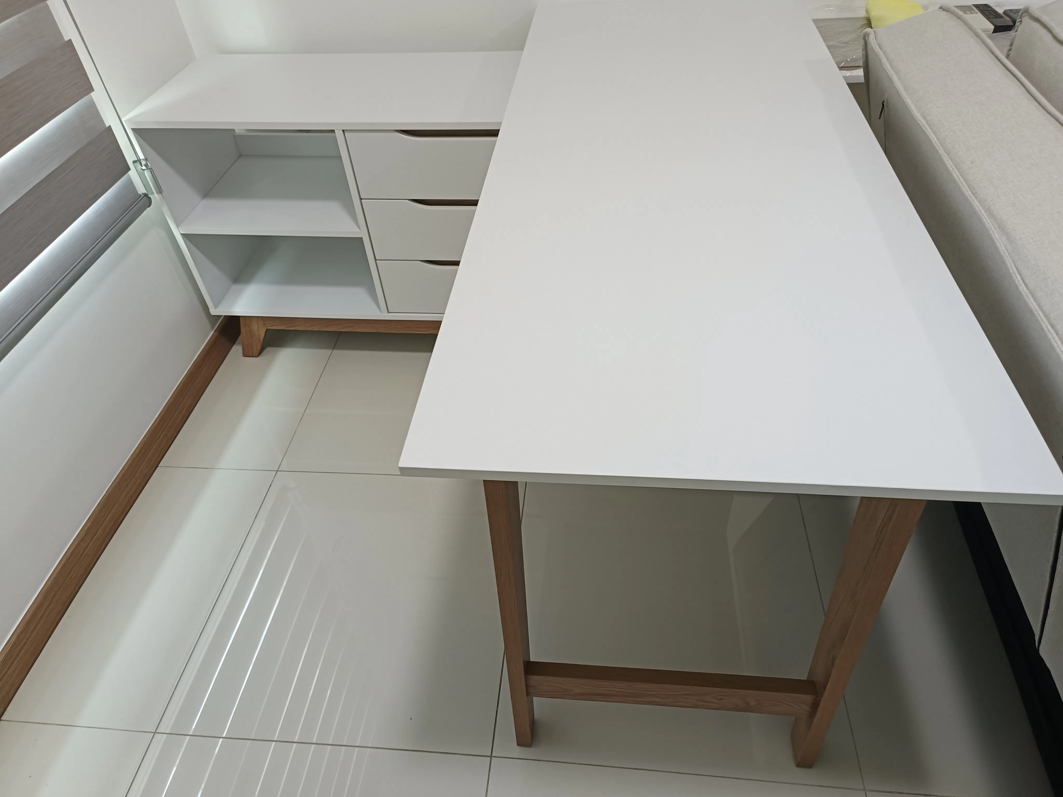 Customer home photo 3: Table top is bigger than expected but it is good. It is an unusual piece of table with side cabinet. 👍