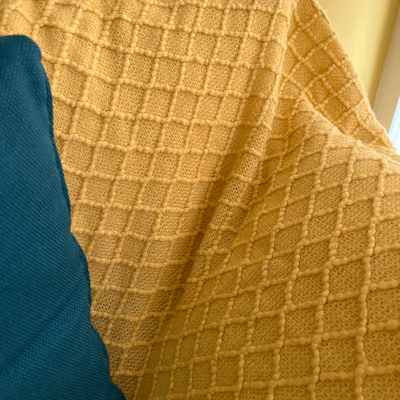 Customer home photo 1: Bought 2 pieces. Material is so comfortable. I’ve machine washed 2x so far yet they didn’t go out of shape & colour remains vibrant. I wished I’ve also bought the blue piece at the same time - as there’s only 1 piece in stock now.