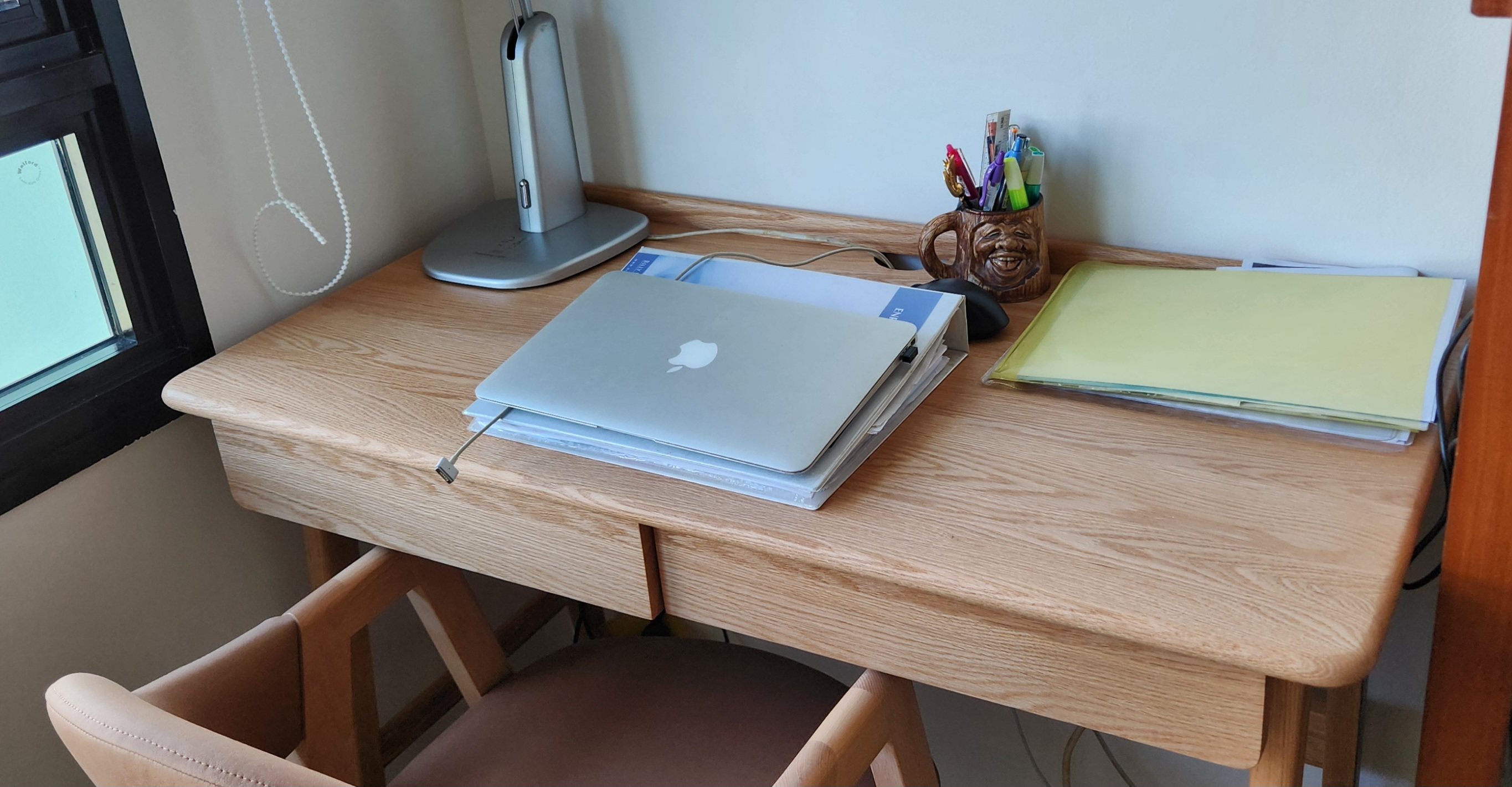 Customer home photo 2: The Japandi look matches the rest of decor very well. Table feels solid enough but the drawers somewhat flimsy.