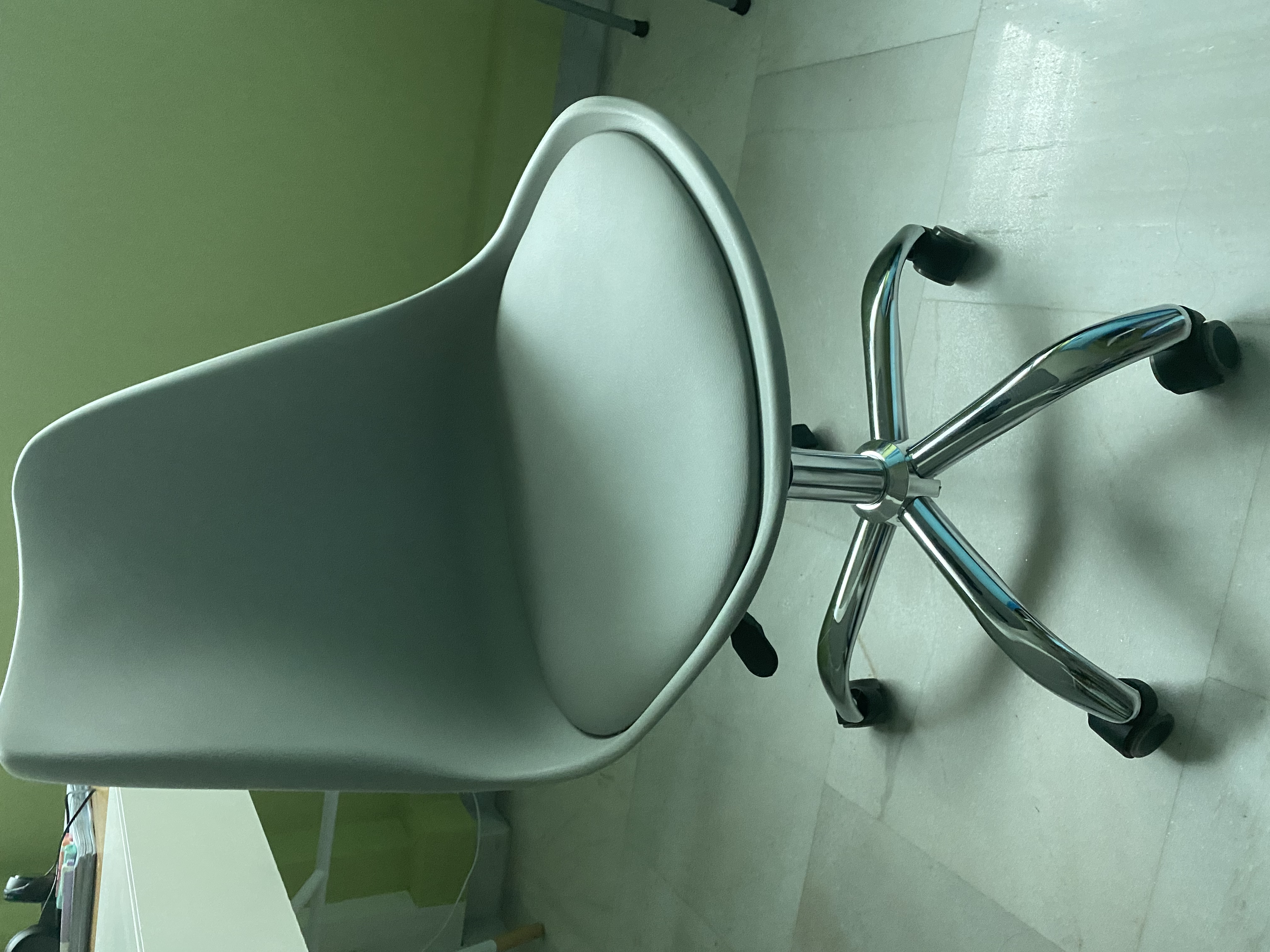Customer home photo 3: Love the colour of the chair. It  is comfortable as it cones with a cushioned seat pad and is very easy to assemble. The wheels make slight squeaky sound sometimes though.