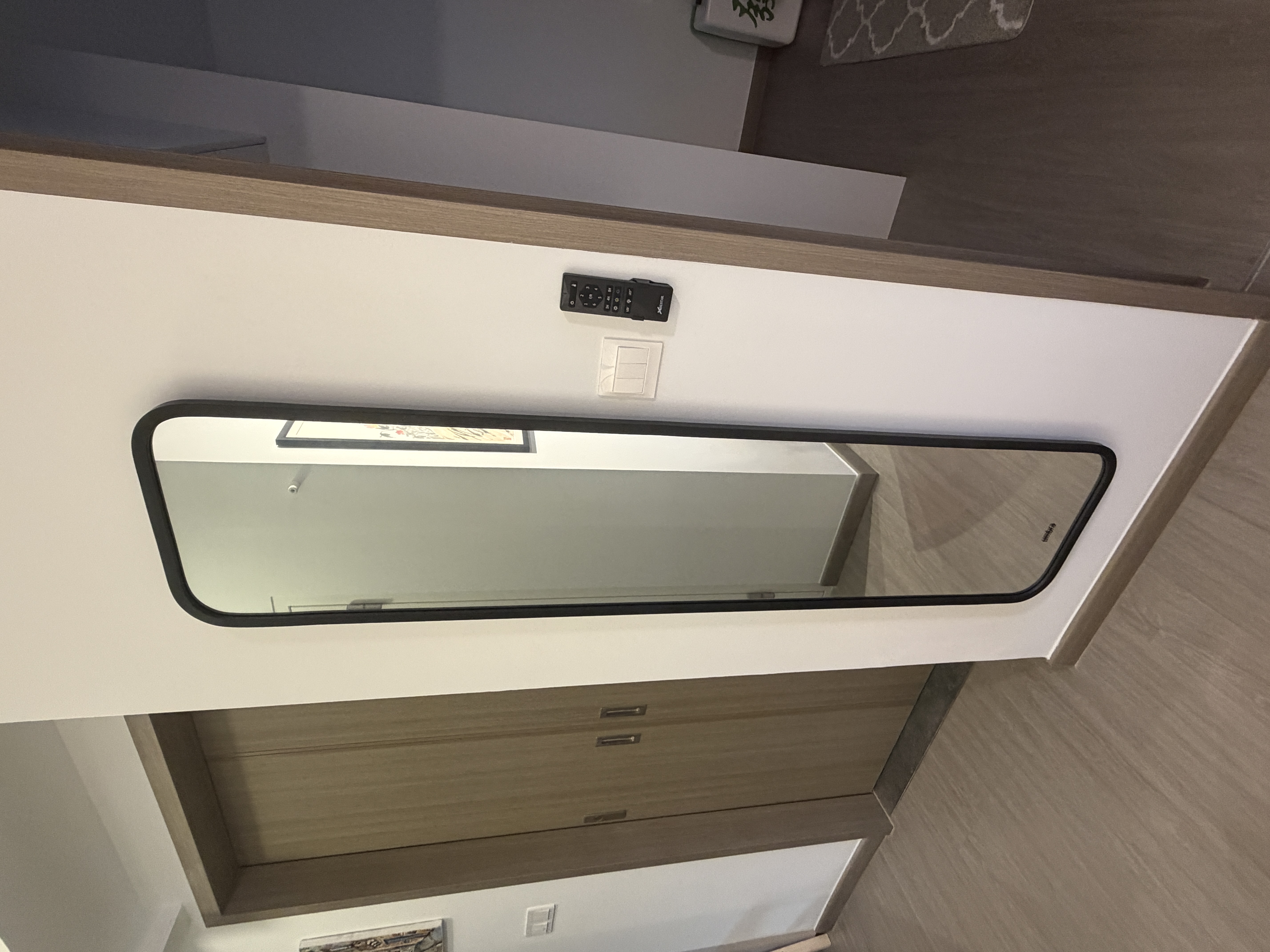 Customer home photo 2: I like this mirror - looks modern and adds a ice touch to my living room