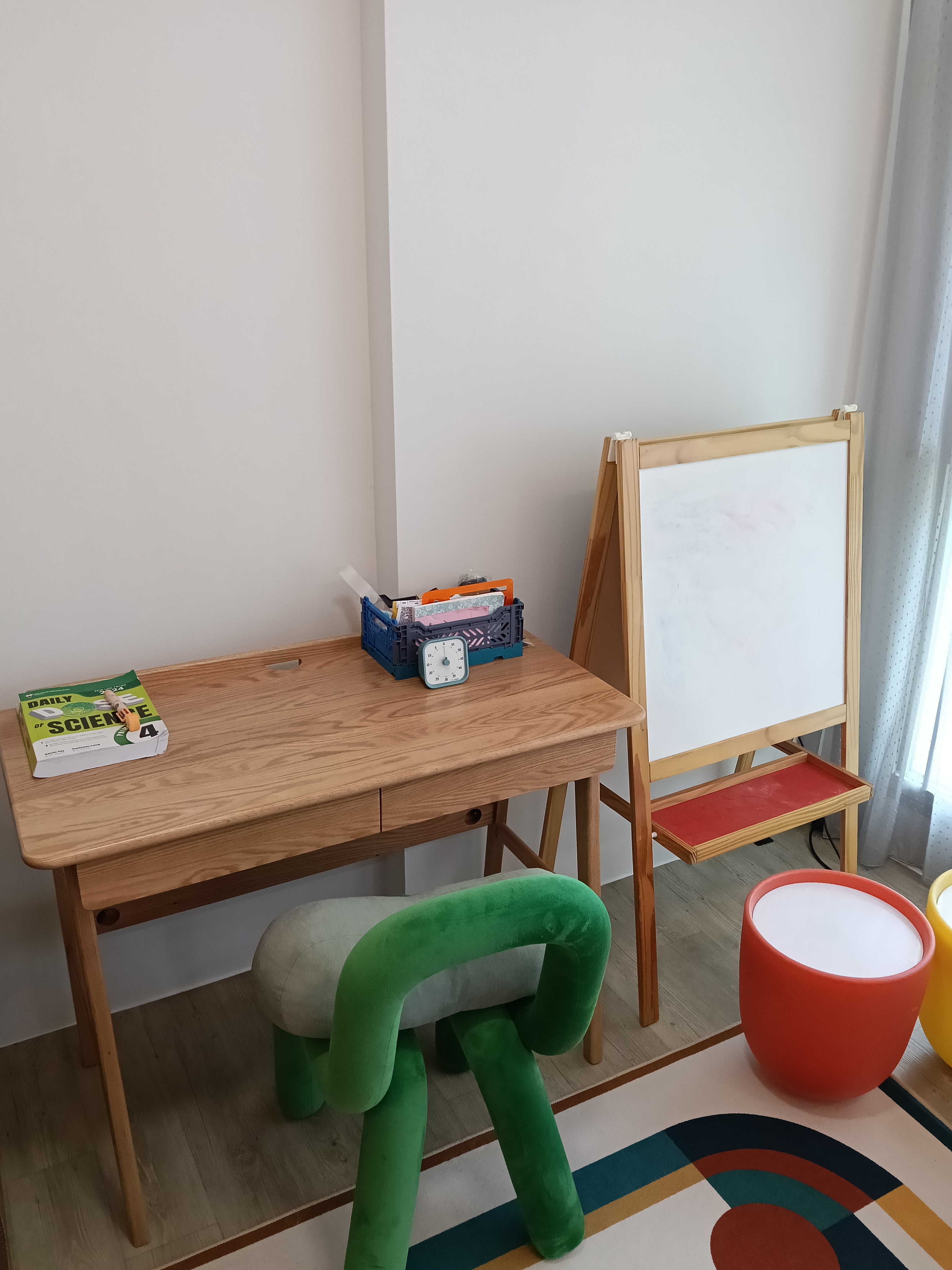 Customer home photo 1: Good quality and sturdy wooden table. Has 2 drawers that are useful for storing stationary.