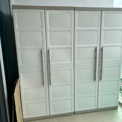 Customer home photo 1: This is the 2nd one that I had bought in less than 1 month. The outdoor cabinet is great for storage. Now my balcony looks tidy and spacious.