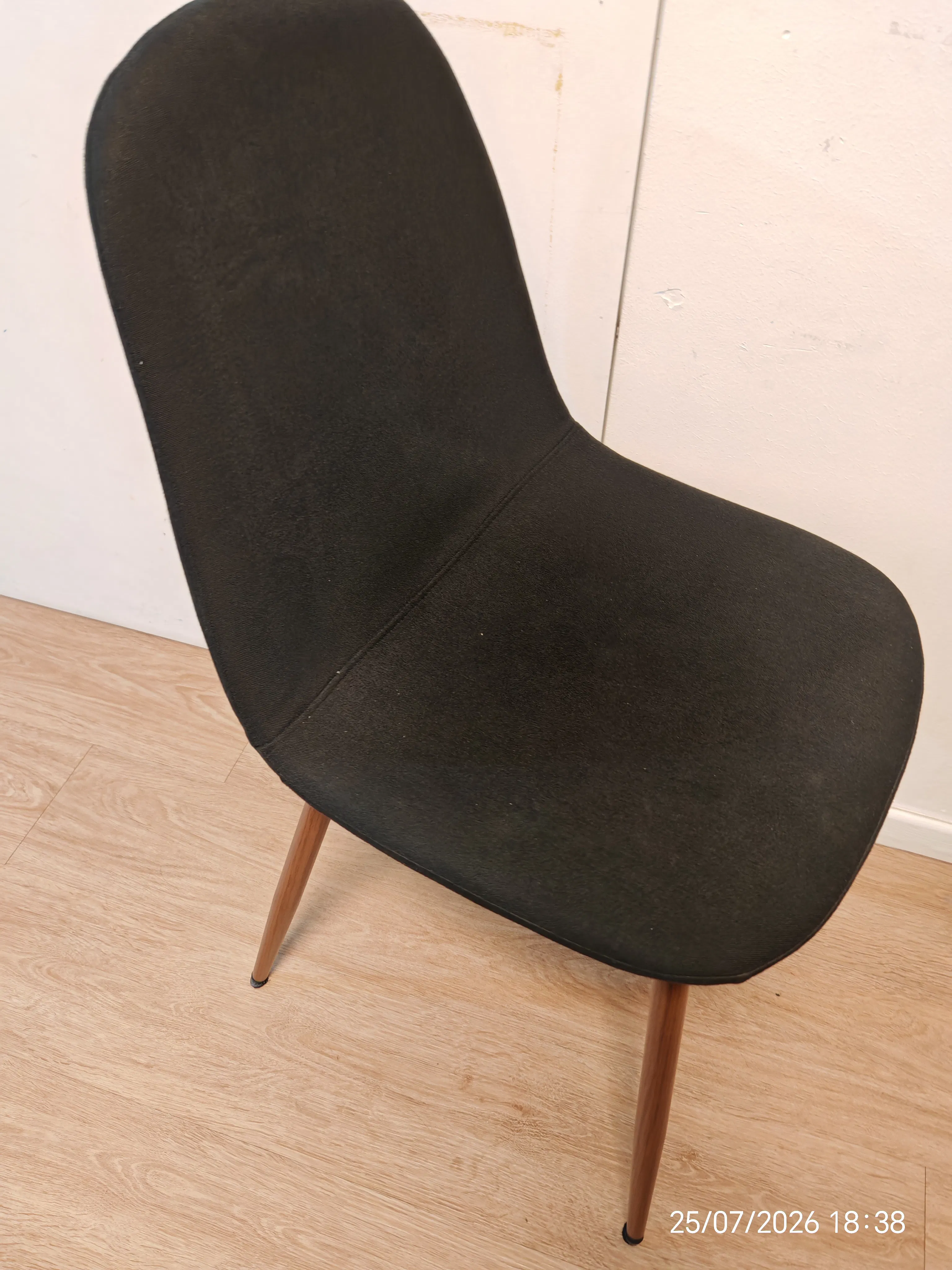 Customer home photo 1: Cheapest chair available that suits the home. Only down side is the base of the legs are screwed on so may loosen should one drags the chair.