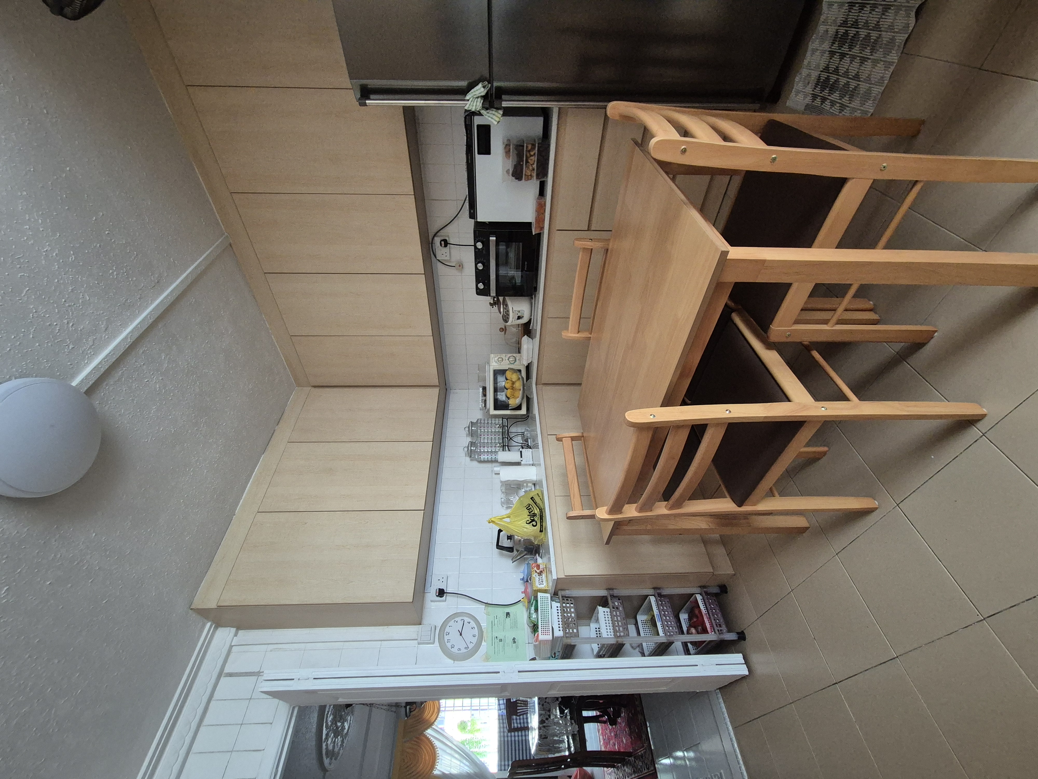 Customer home photo 3: It fits perfectly for my parents kitchen. The quality is top notch when I felt the texture of the table and chairs!