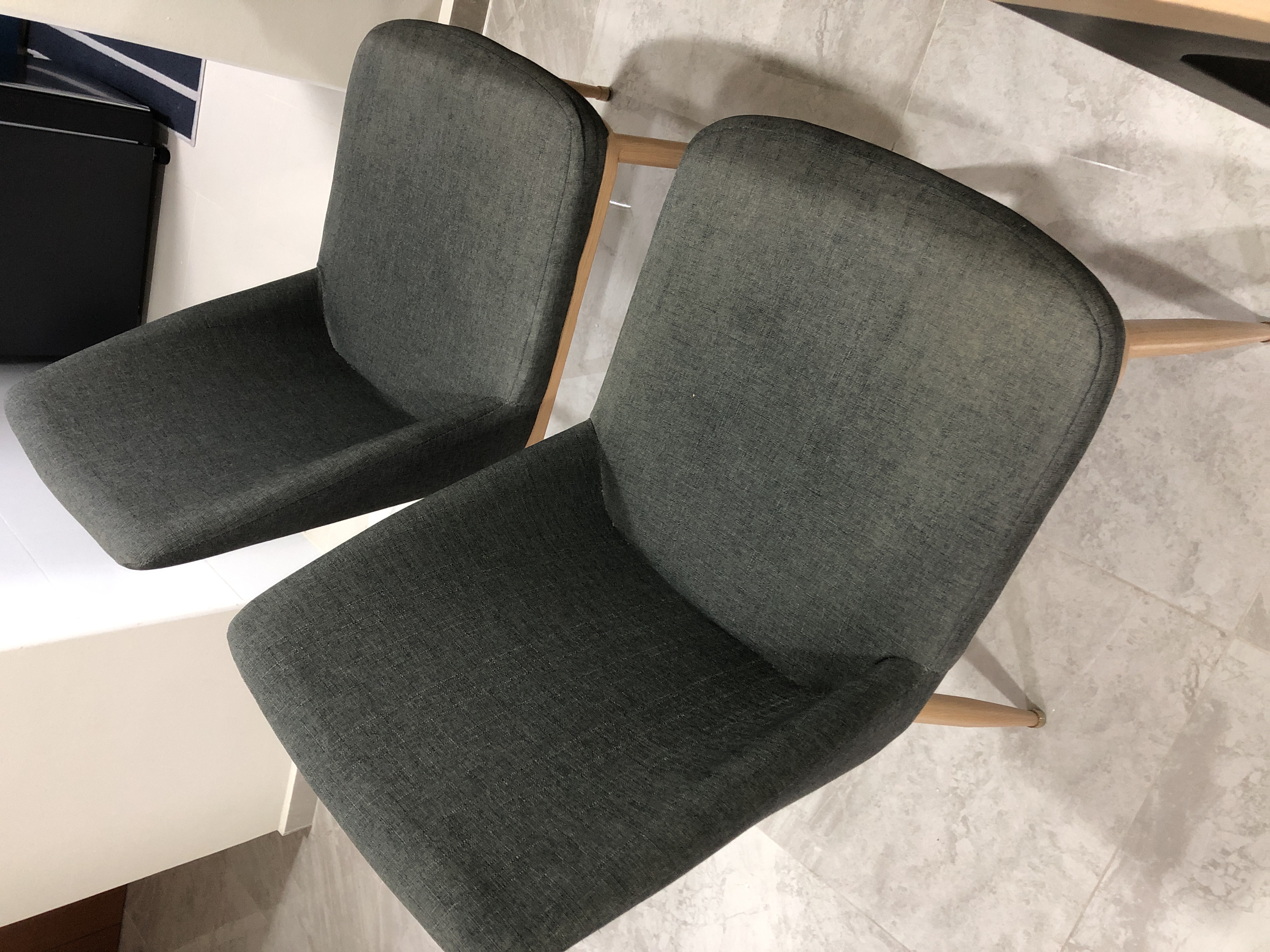 Customer home photo 9: The Kate dining chairs are stylish and we still in love with  it, great ! The only drawback is the cushions loses it firmness and sinks down almost sitting on the wooden plank.