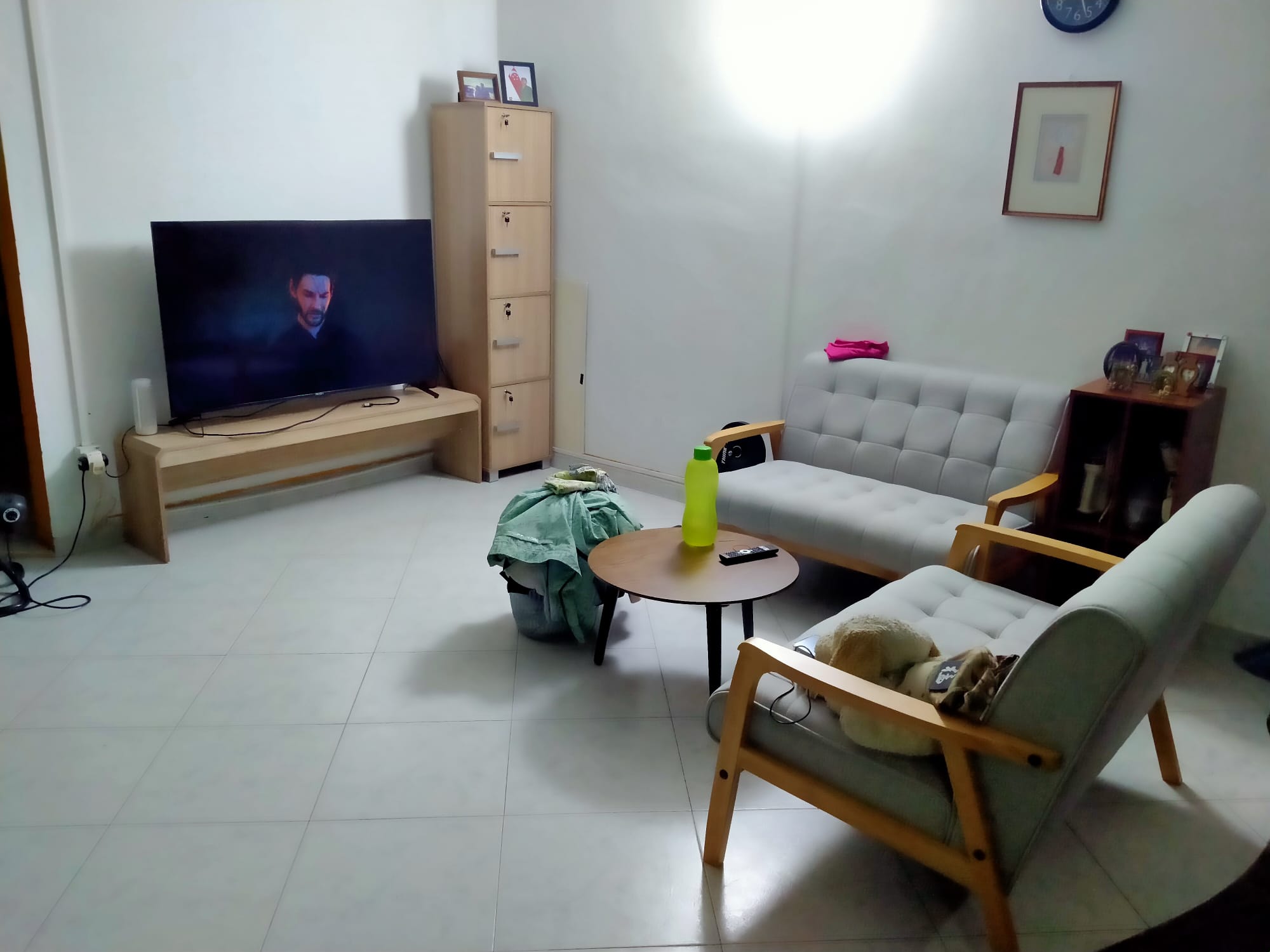 Customer home photo 1: Cabinet is sturdy and colour matches with my tv bench. Now my living looks so much more spacious. Love the minimalism look of the living room area now.