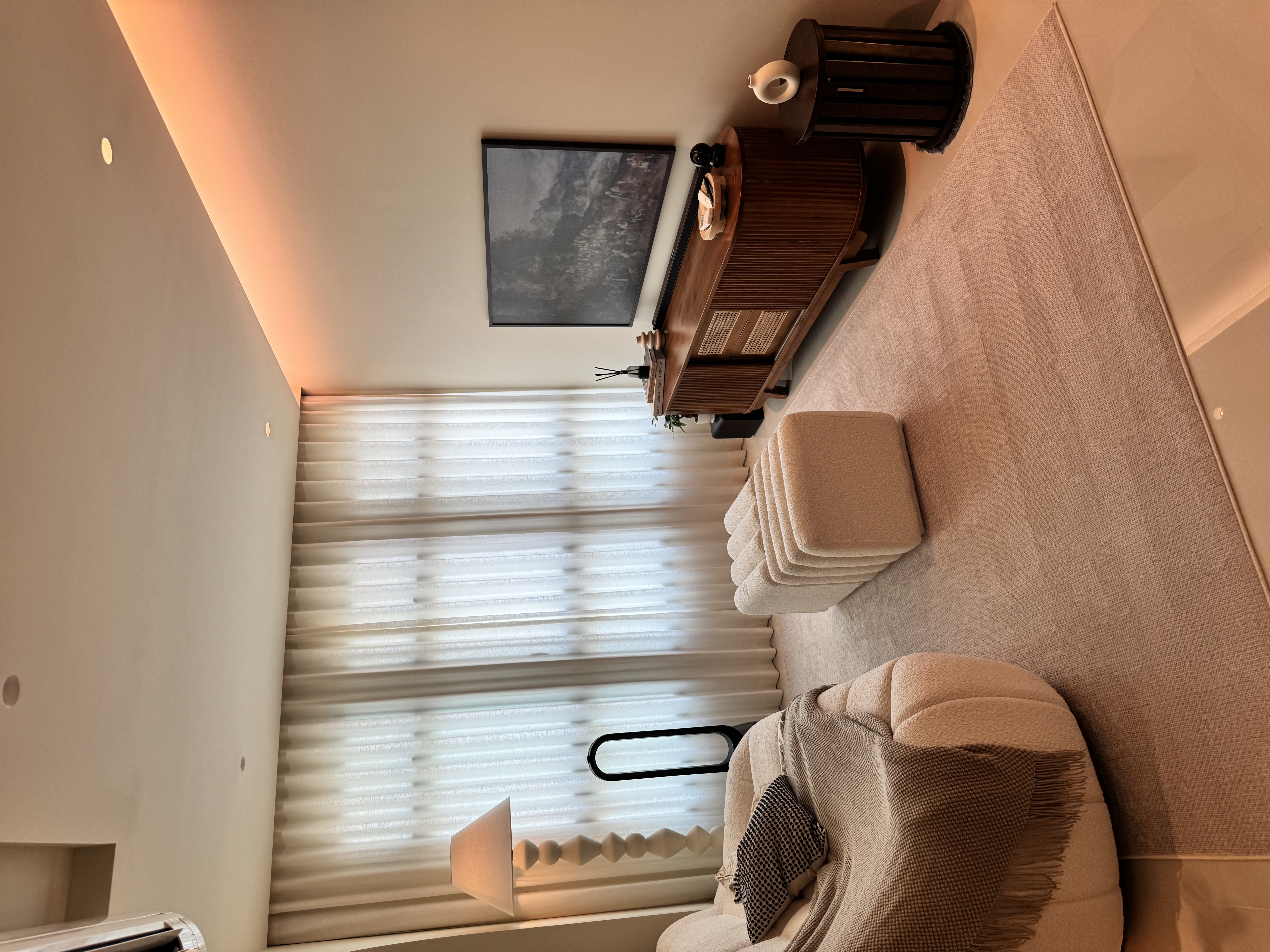 Customer home photo 4: This piece was originally used at my vanity, but when placed in the living room, my partner gave me the idea that it could used as a coffee table or a seat, while remaining easy to move when needed.