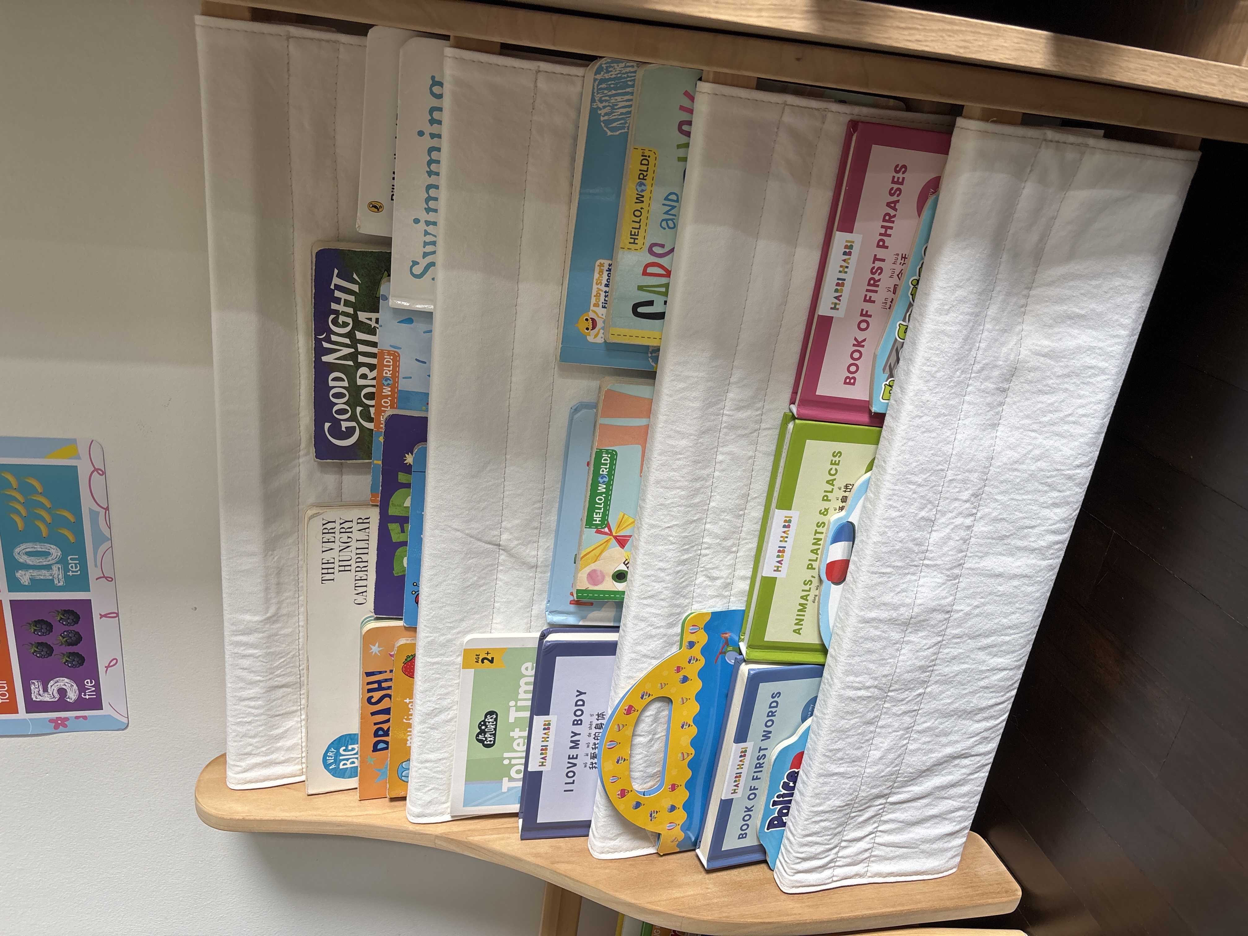Customer home photo 2: Item came assembled so delivery was fuss free. Quality is good. Only downside is that the thickness of each pocket is quite thin so can only squeeze in 1 thick book or 2 thin books per space.