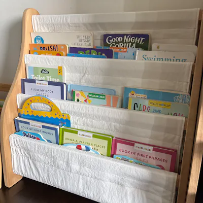 Customer home photo 2: Item came assembled so delivery was fuss free. Quality is good. Only downside is that the thickness of each pocket is quite thin so can only squeeze in 1 thick book or 2 thin books per space.