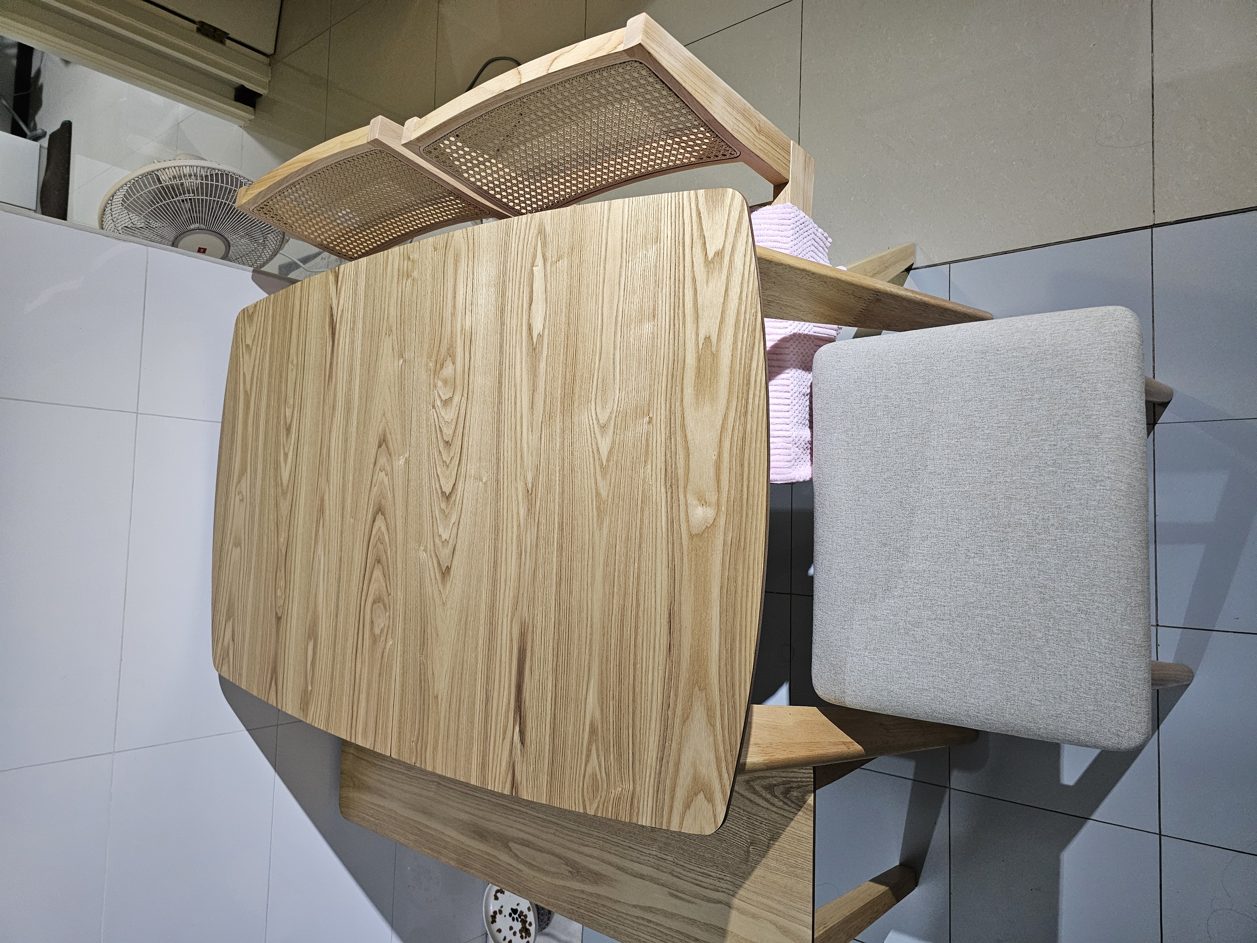 Customer home photo 3: The dinning table pairs well with the chairs and perfect for smaller space. Its compact and space saving. Extendable features very convenient when when extra seating is needed.