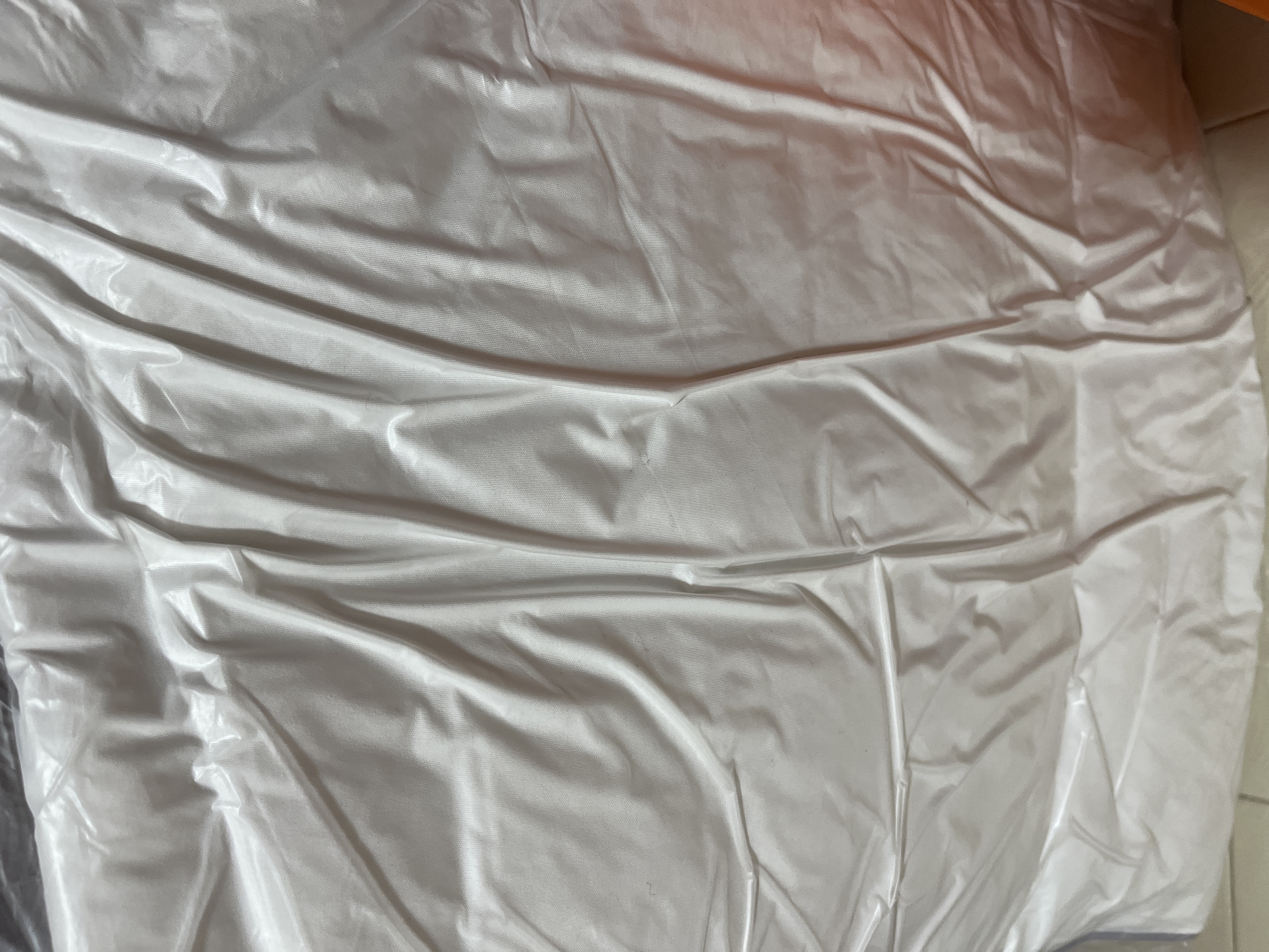 Customer home photo 2: The cushion is nicely vacuumed packed and the size looks very comfortable. Just nice to go with my sofa