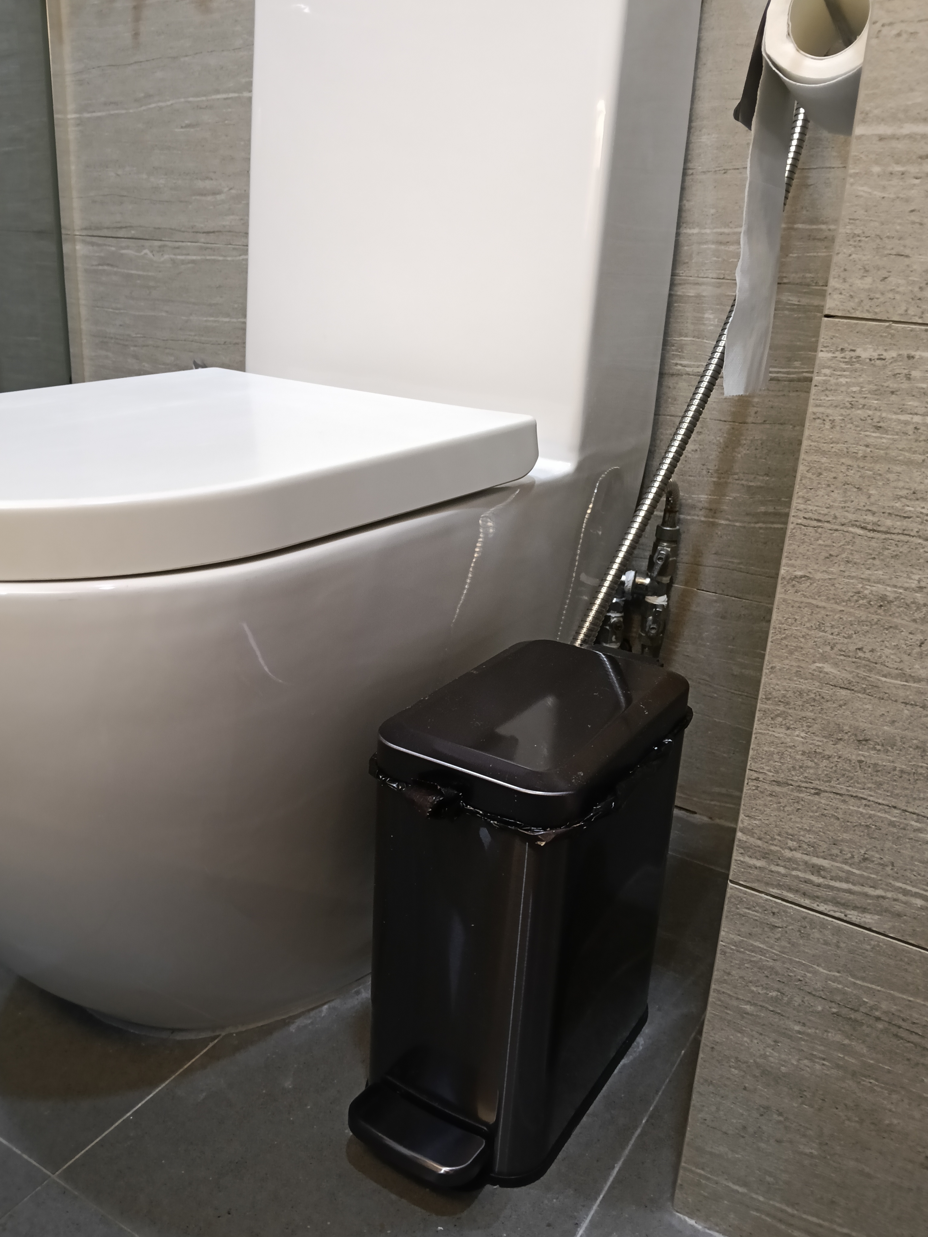 Customer home photo 2: Fits well in the space near to the toilet bowl. Easy to open with soft closing cover.