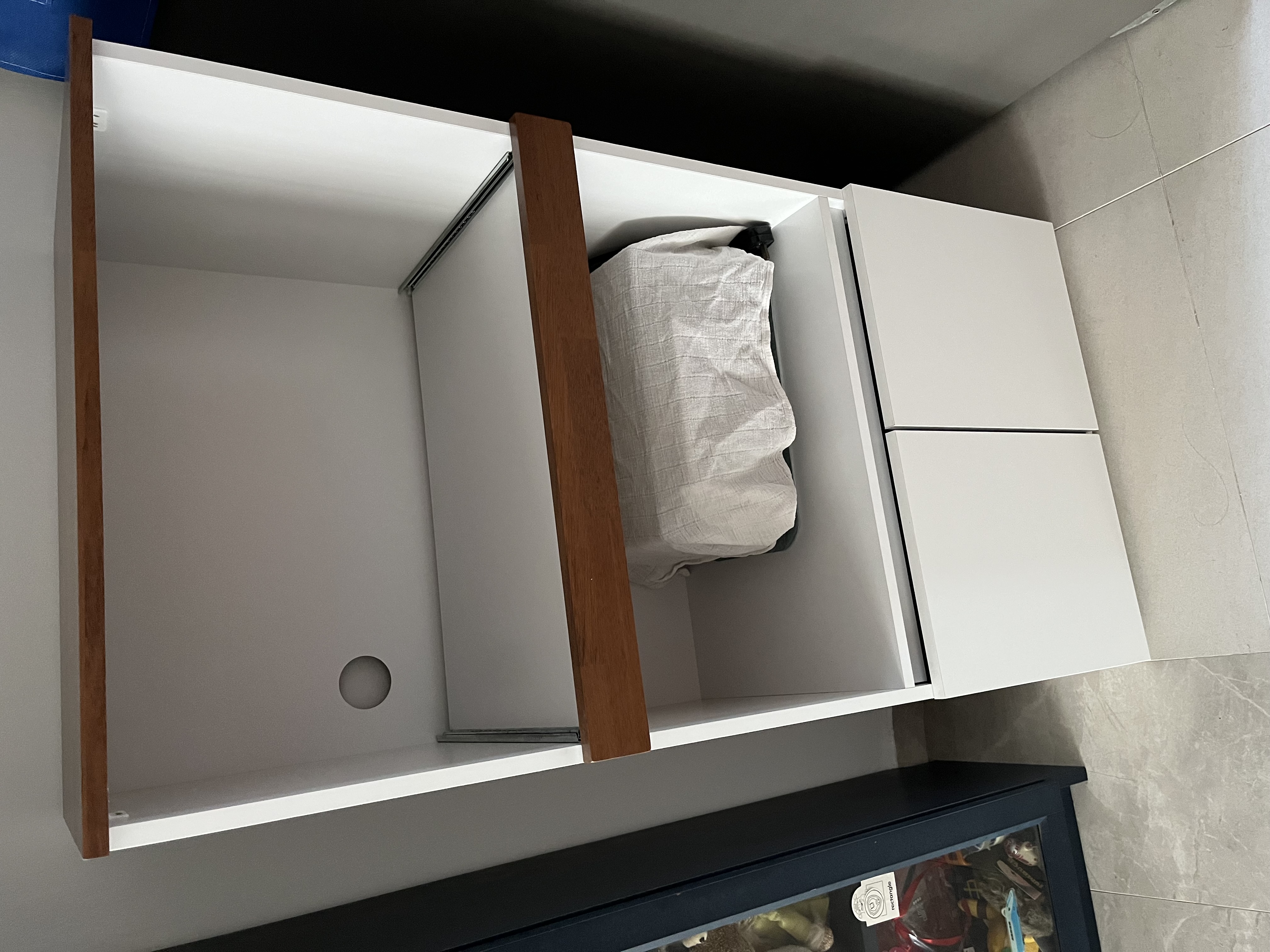Customer home photo 1: Thin and sleek , with a movable cabinet for retrieving things easily