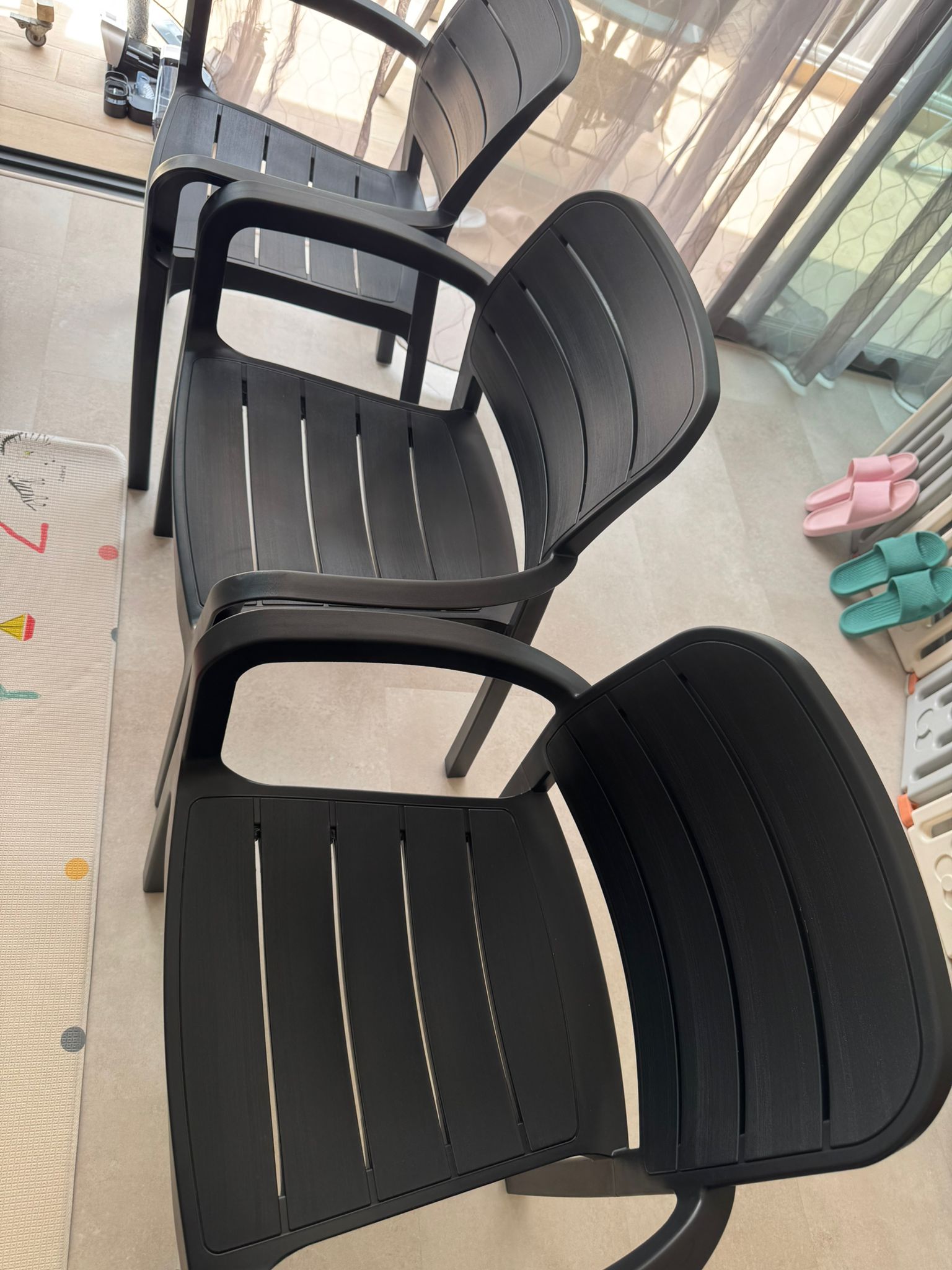 Customer home photo 1: comfy and weather resistant. going to put at balcony for dining. glad that we picked this with armrest! no regrets. Price was reasonable i think