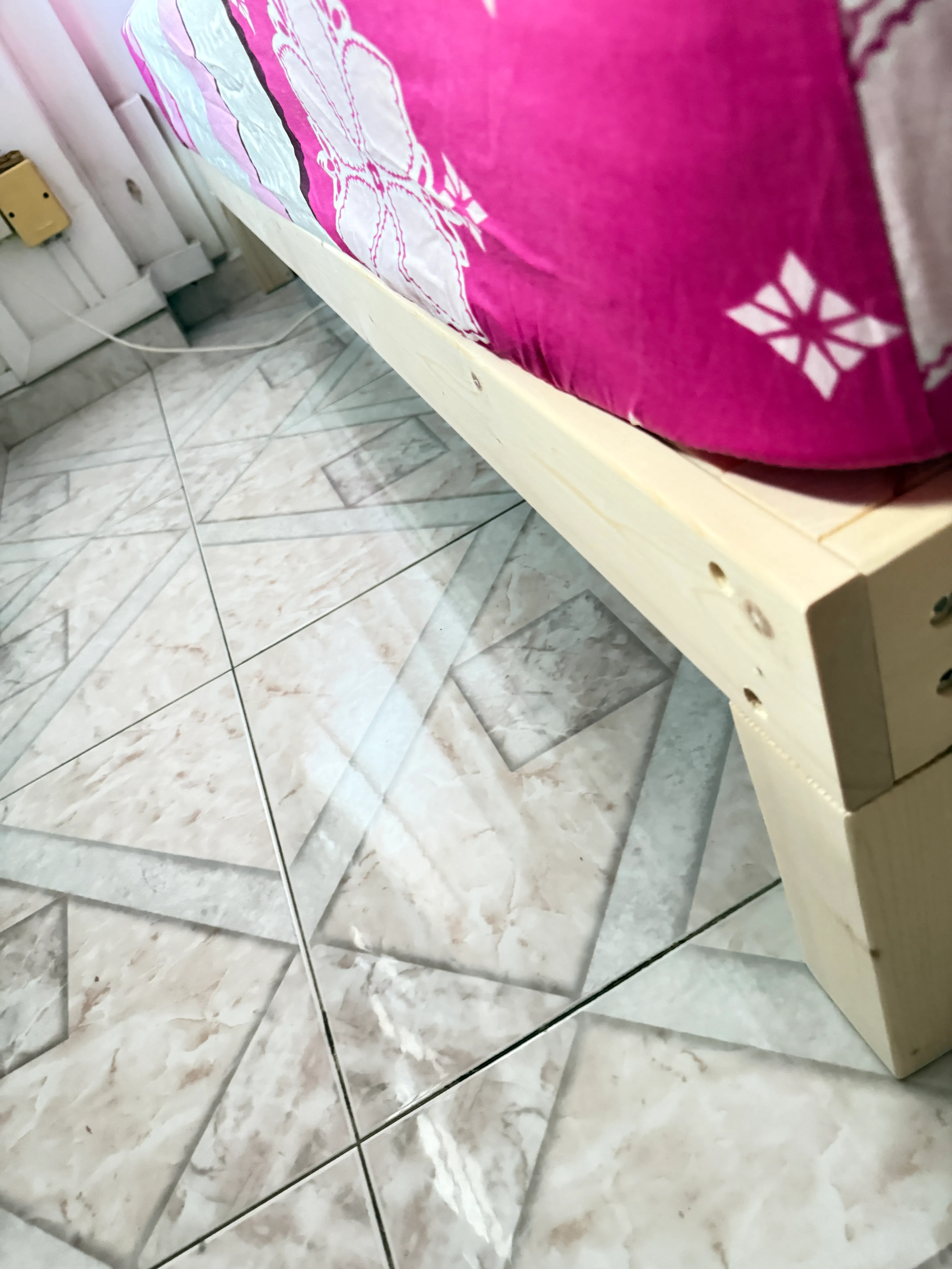 Customer home photo 1: The bed frame is sturdy enough to hold my mattress.