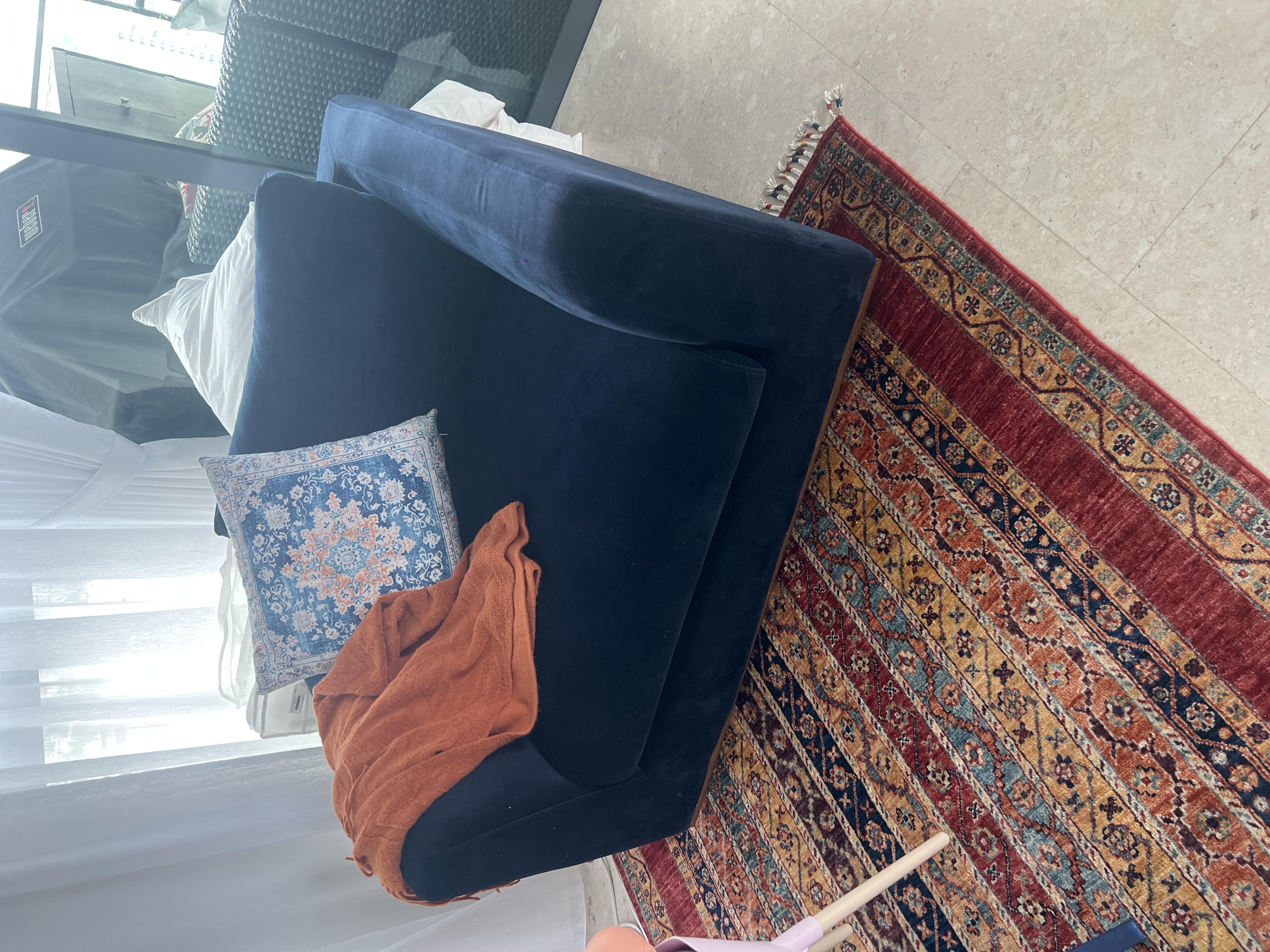 Customer home photo 3: Looks amazing on a navy couch, is soft and cozy