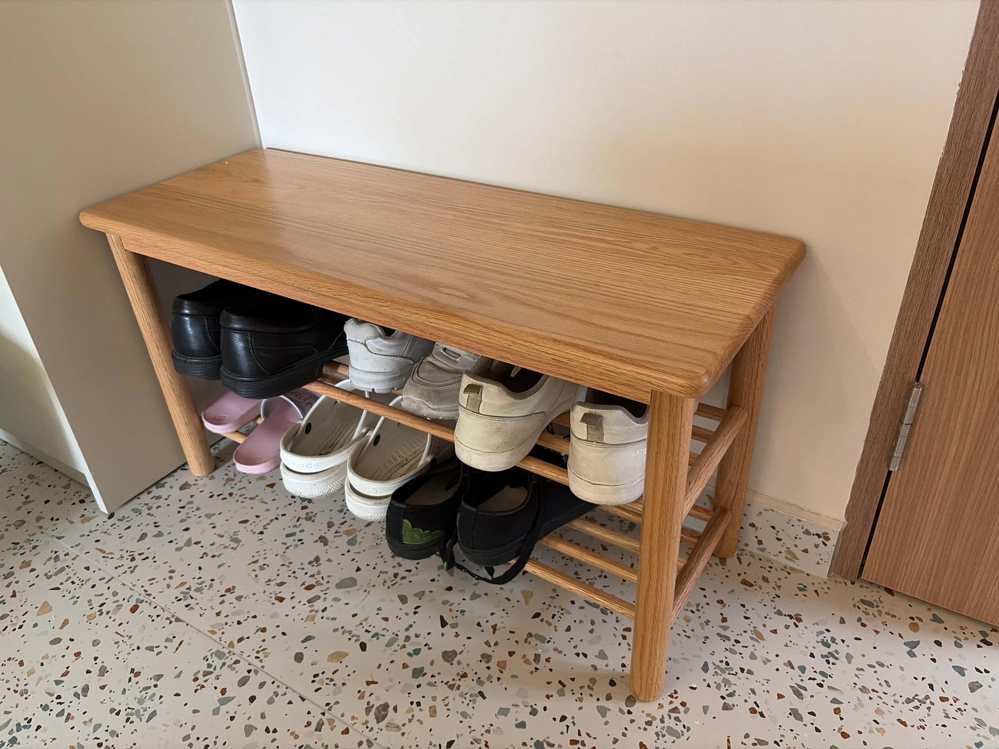 Customer home photo 4: This bench / shoe rack is compact and fits the space nicely near my entry.