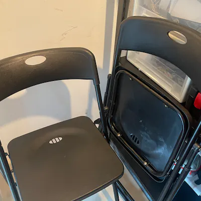 Customer home photo 3: Bought x2 of these folding chairs. Durable and space-savvy.