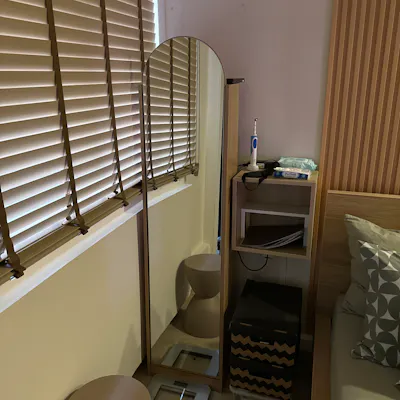 Customer home photo 10: Really like the arched mirror…the shelves inside is genius. The piece is solid & of superb quality. Adds sophistication to our room…love this 😘