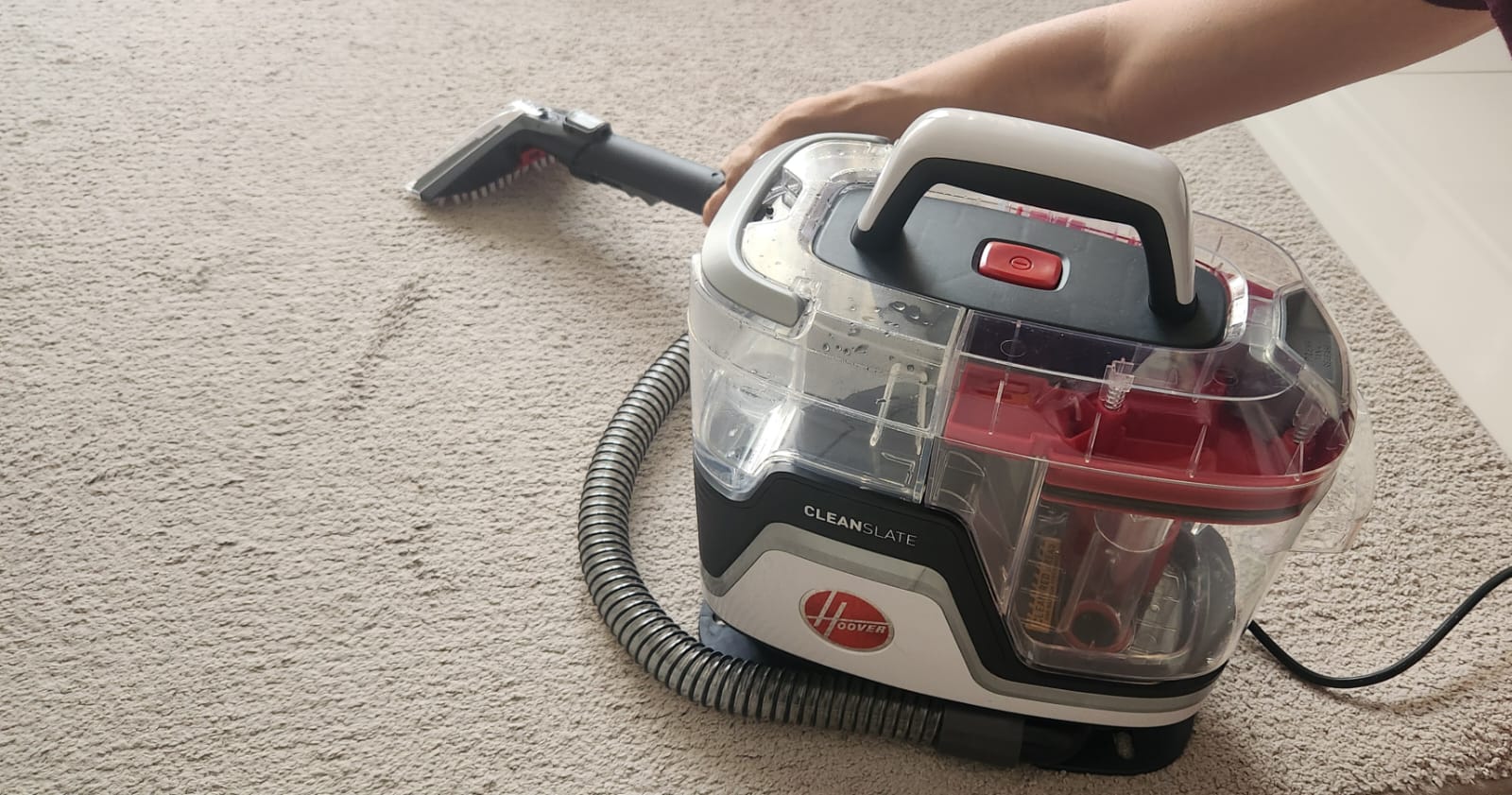Customer home photo 1: Neat and compact machine that works effortlessly in cleaning carpets, rugs, fabric furniture, and mattresses. Good long power cord. Maybe a slightly longer cleaning hose would be a small improvement, but as it is there is no real restriction on cleaning.