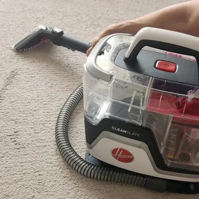 Customer home photo 1: Neat and compact machine that works effortlessly in cleaning carpets, rugs, fabric furniture, and mattresses. Good long power cord. Maybe a slightly longer cleaning hose would be a small improvement, but as it is there is no real restriction on cleaning.