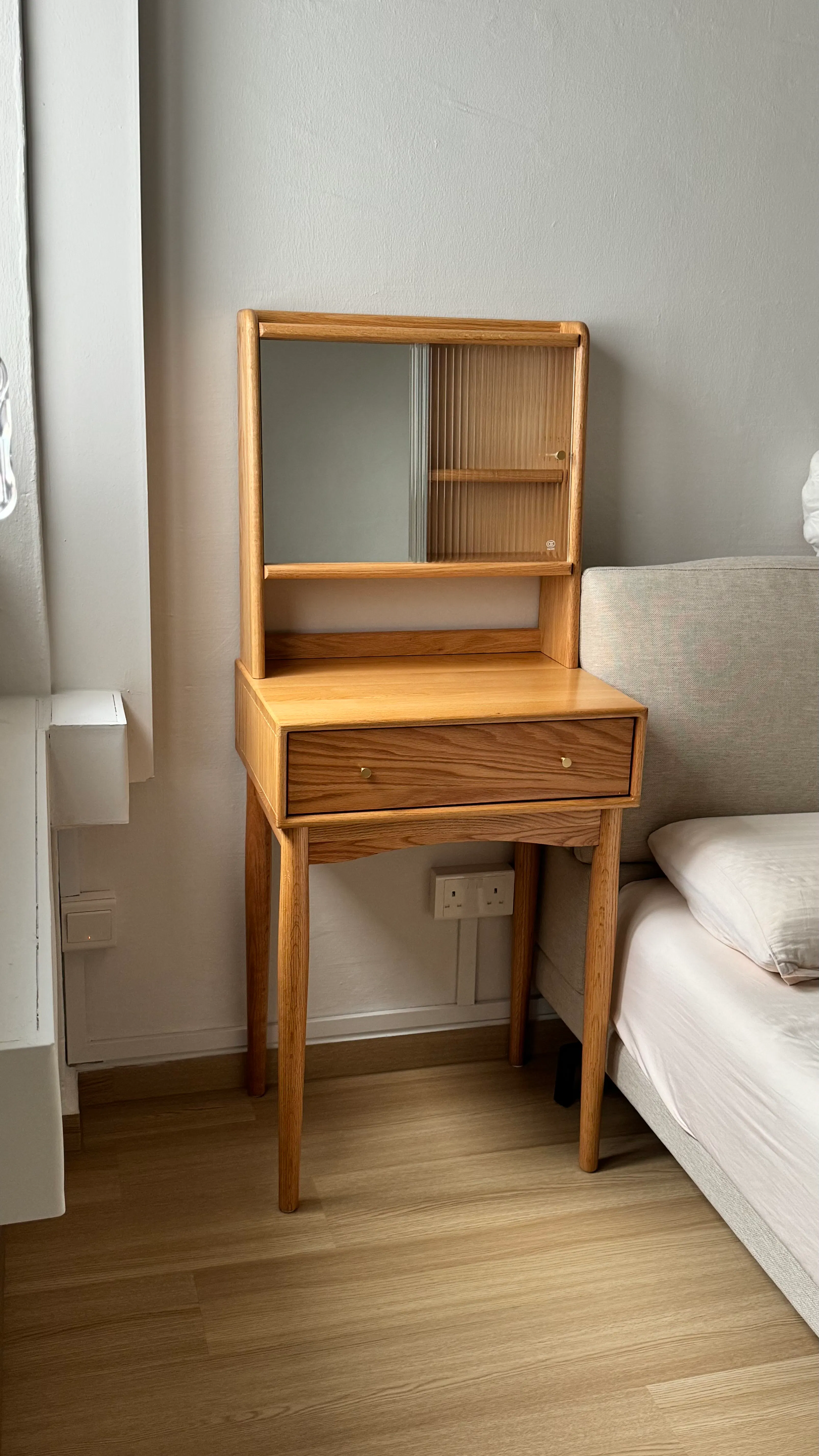 Customer home photo 1: Overall happy with the quality. The table top and the shelf unit are separate pieces that are fastened together but it’s not very sturdy and excessive force will probably break the two apart. Must handle gently. The drawers are shallow, but good enough for things like jewellery boxes, pouches, small items. After all, it’s a compact slim dresser.