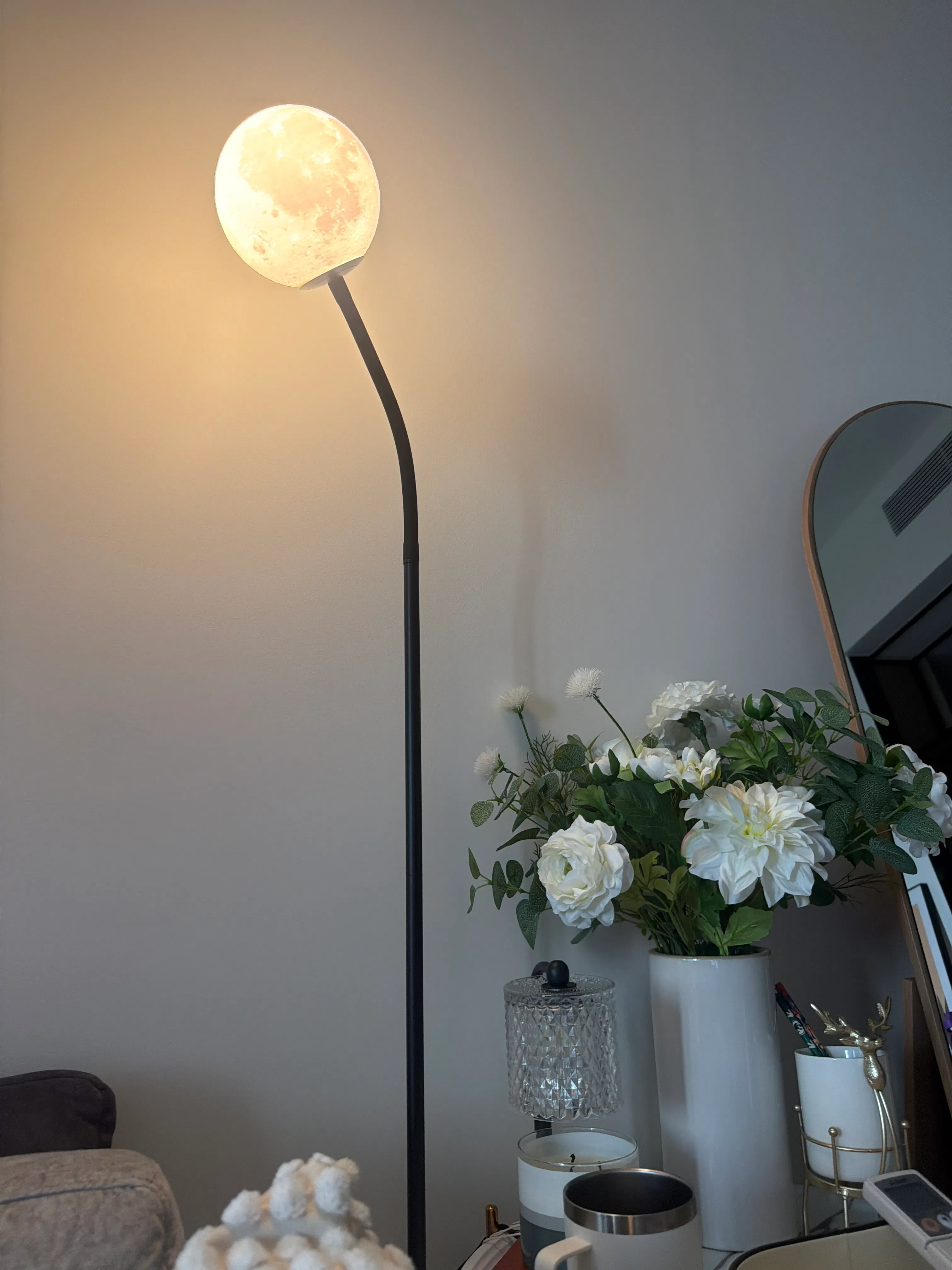 Customer home photo 1: Love that it looks like a moon! The bulb was not included so make sure you order bulb together when you order this lamp.