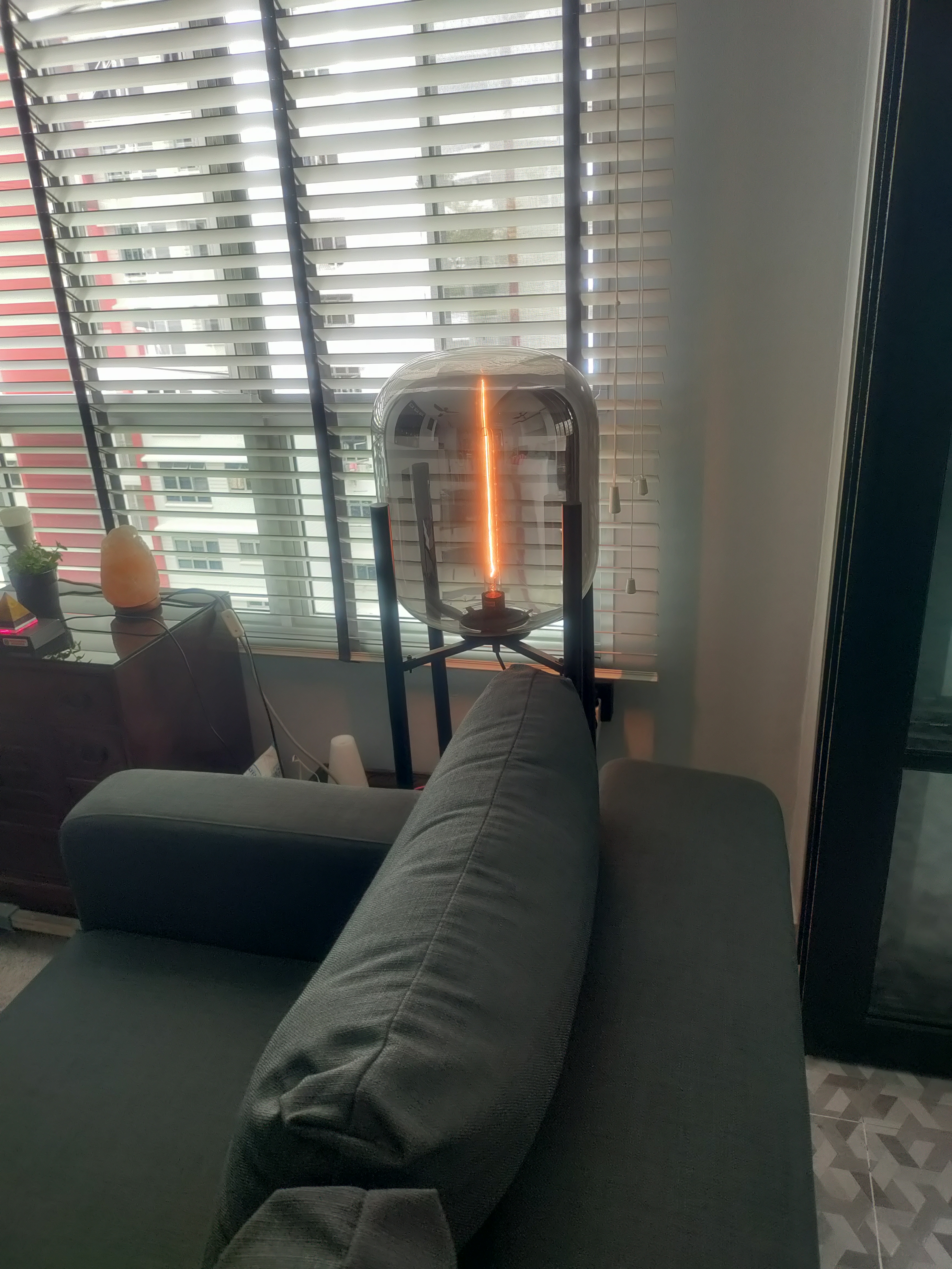 Customer home photo 2: This floor lamp looks really chic & classy in my living room, lending an air of understated elegance. Most visitors to my home always comment that this lamp looks unique & pretty. The light it gives off is a warm glow imparting a sense of comfort. Do not expect this lamp to give enough light for reading though.