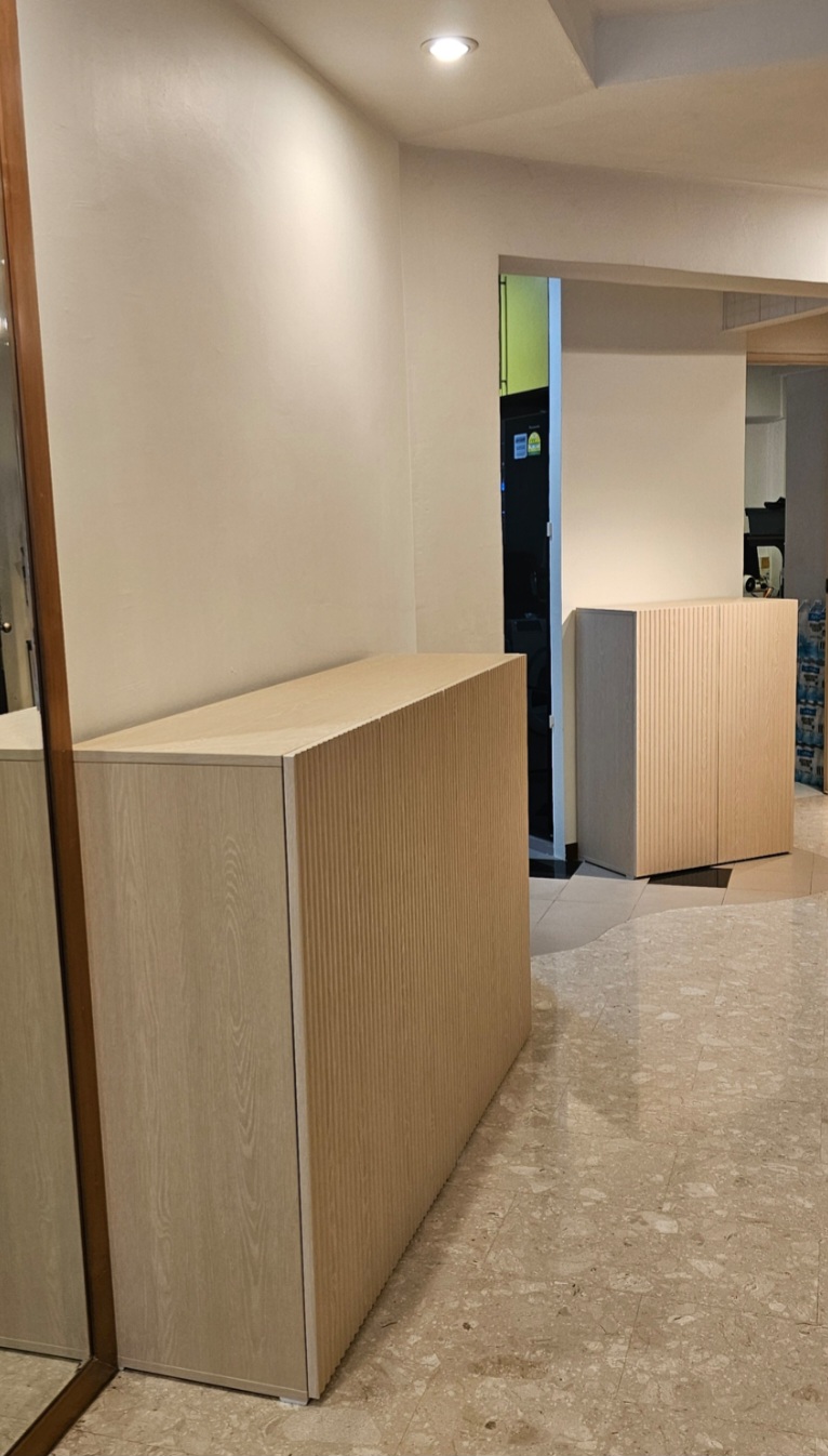 Customer home photo 40: Happy with the cabinets. In fact, we have ordered another 1.2m unit. However, wish there could be another shelf and more holes to adjust the heights of the shelves. Needs more time to get rid of the 'new cabinet smell'. It has been a week, smell still strong.
