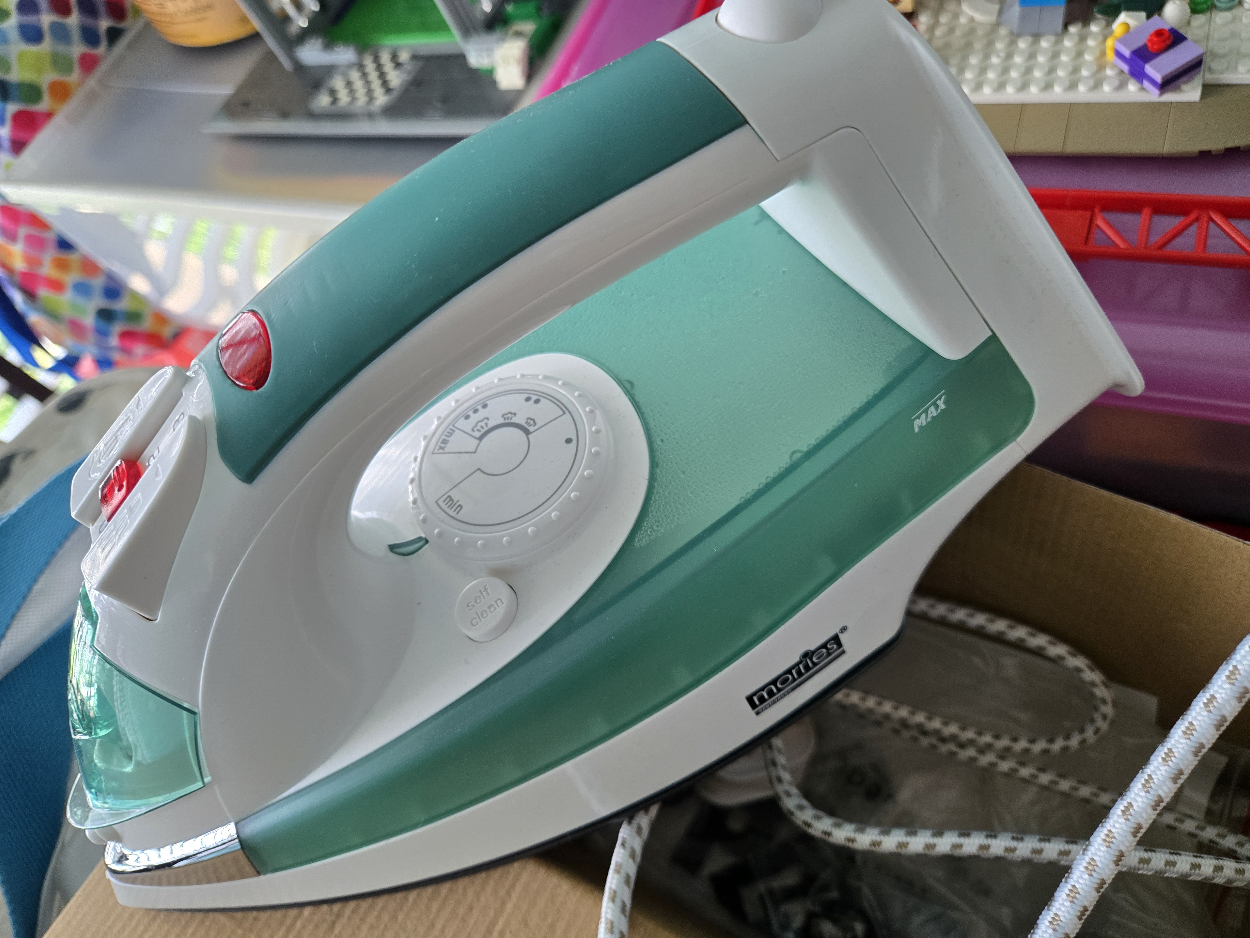Customer home photo 1: The MORRIES Steam Iron (2000W) is a reliable and affordable option for everyday ironing needs. It heats up fast, removes wrinkles efficiently, and has useful features like steam and spray functions. While a slightly larger water tank and longer cord would be a bonus, it still performs well for its price. If you're looking for a budget-friendly steam iron that gets the job done, this is a great choice!