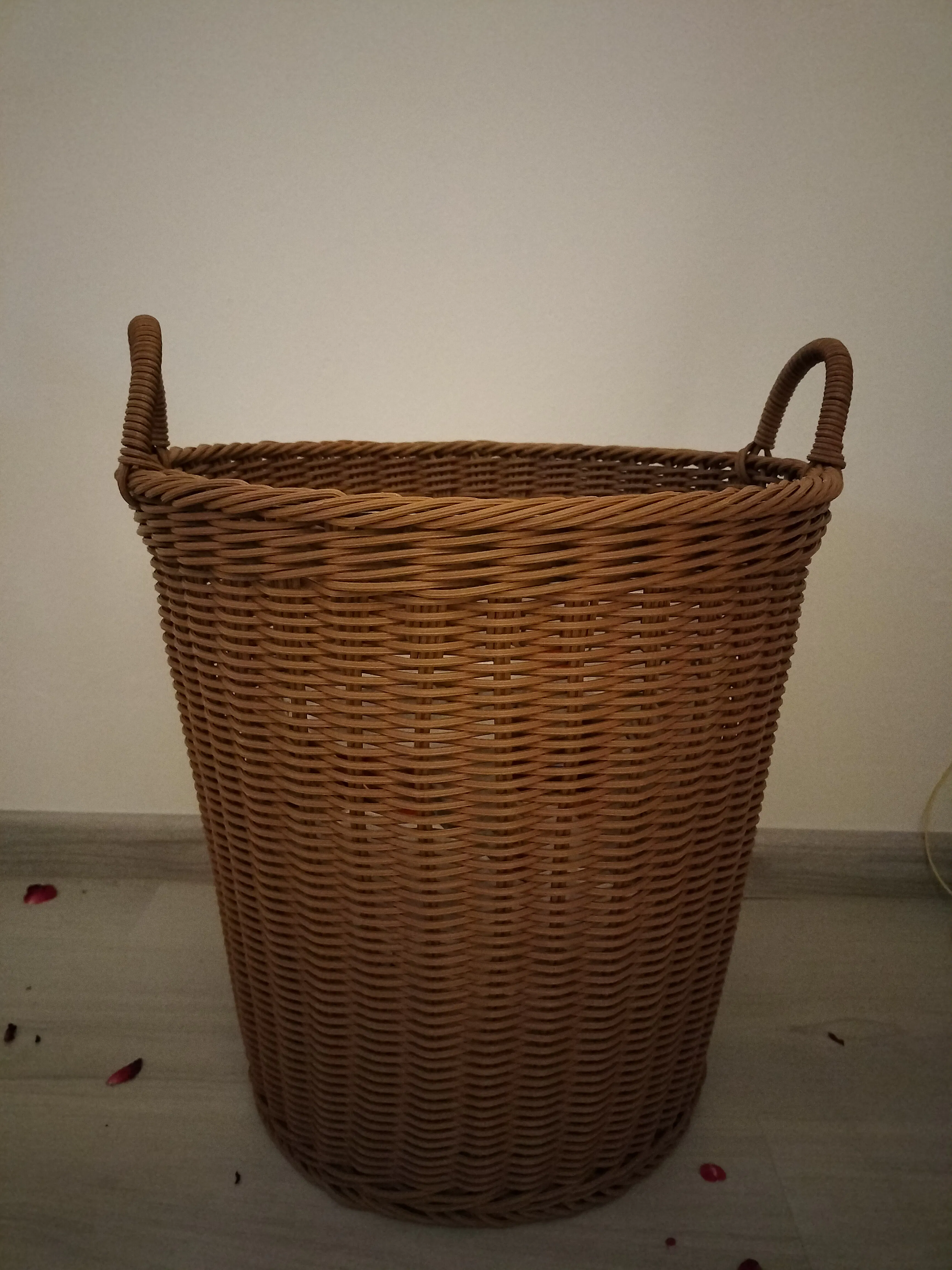 Customer home photo 2: The basket is softer than typical rattan baskets, but it's sturdy and can be used for storage purpose.