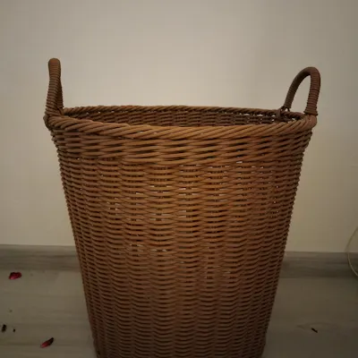 Customer home photo 2: The basket is softer than typical rattan baskets, but it's sturdy and can be used for storage purpose.