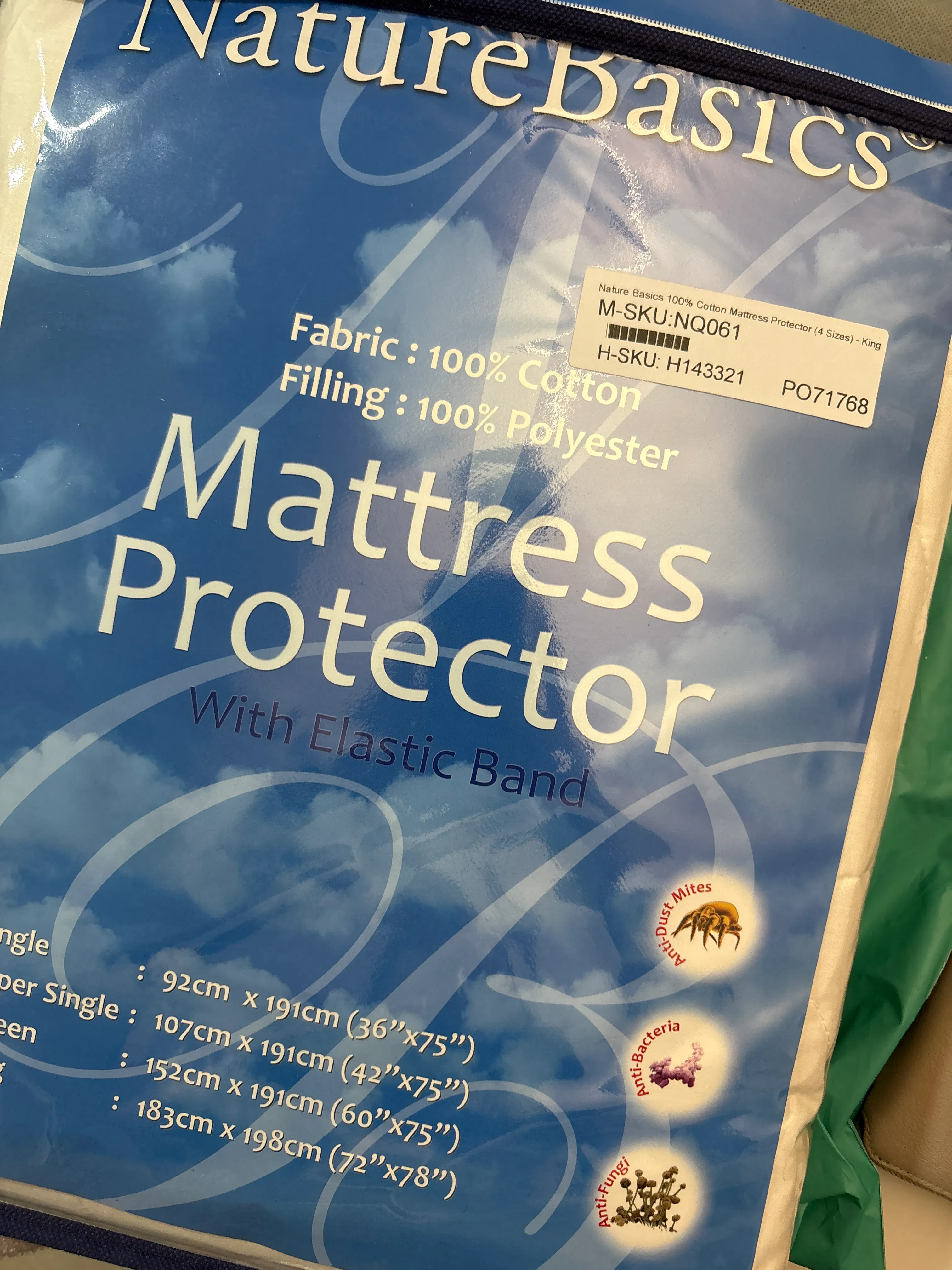 Customer home photo 1: Pretty generic mattress protector, does its job but feels a little on the thinner and coarser side.