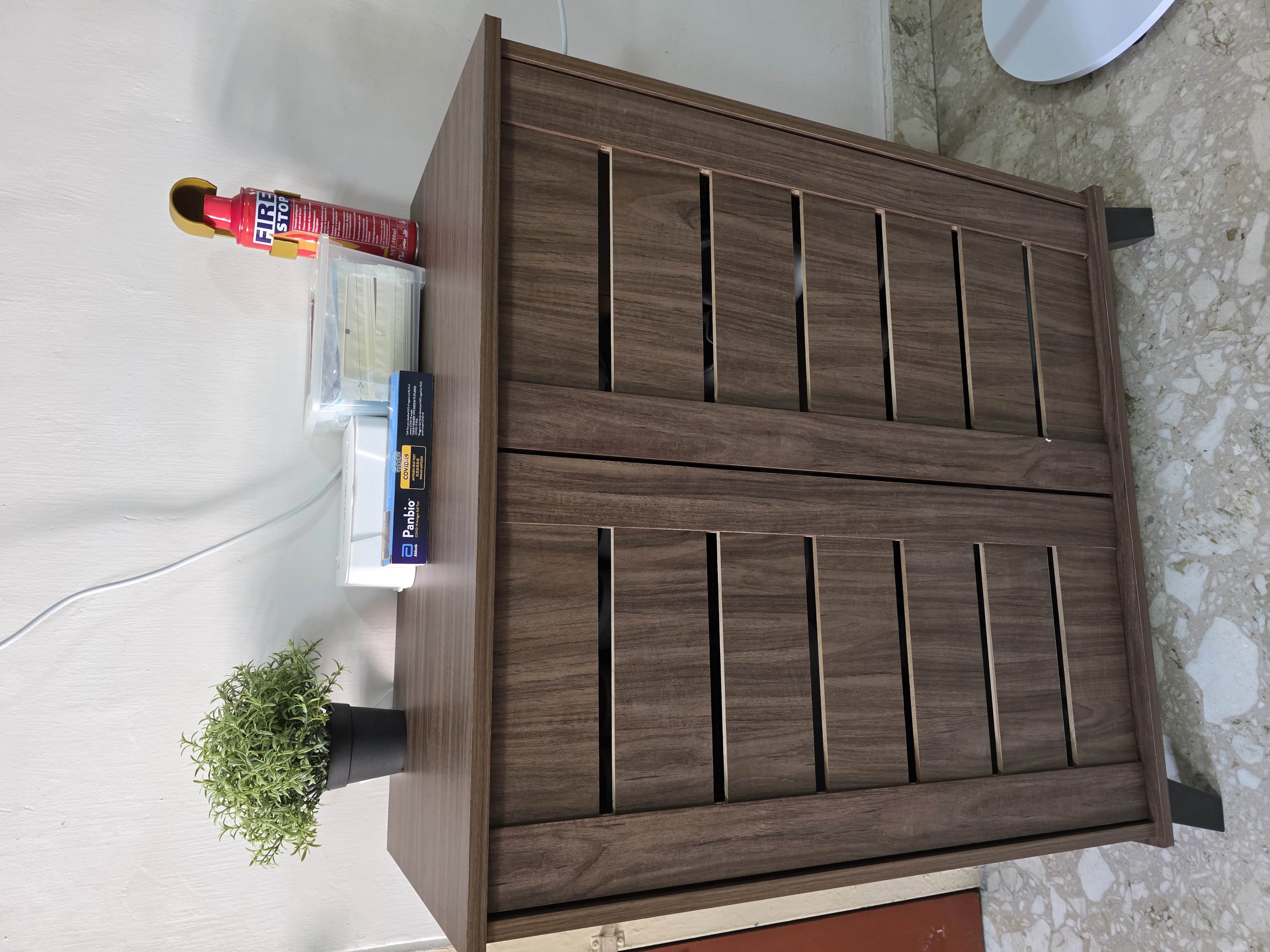 Customer home photo 3: Does the job of keeping shoes out of sight with grooves to air. Thin door does the job.