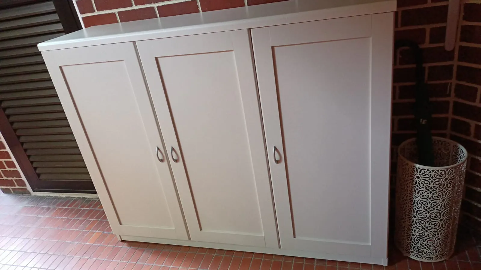 Customer home photo 4: The design looks elegant. I put at the corridor entering house. It is spacious to put up to 36 paid of shoes and boxes !! The racks are adjustable to accommodate shoes which are more bulky and different height.