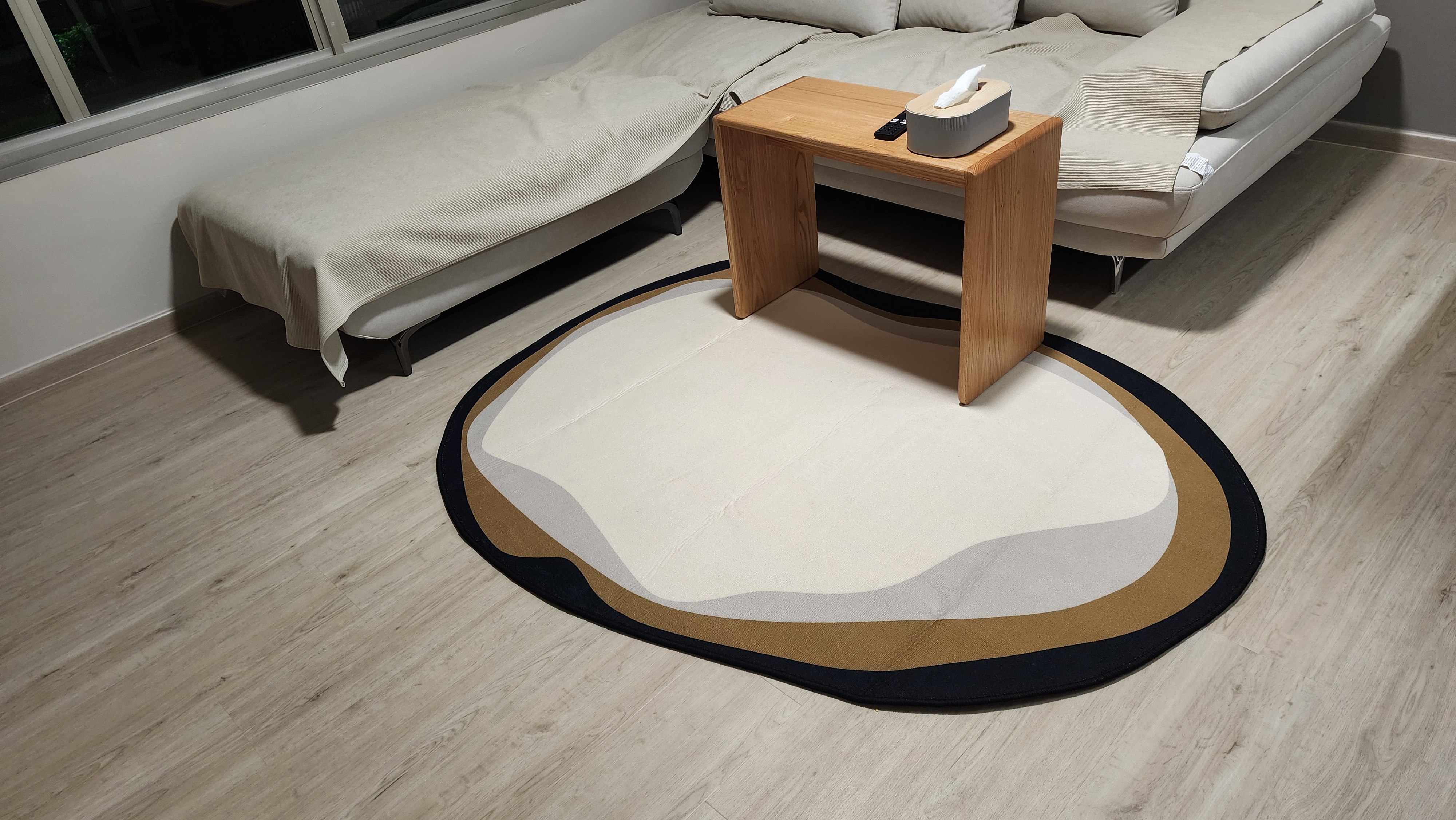 Customer home photo 1: Love that it is asymmetrical, it gives the living room more rounded and cosy feel.  Colours are beautiful.  Only wish that it does not comes with creases. Other than that,  it is perfect