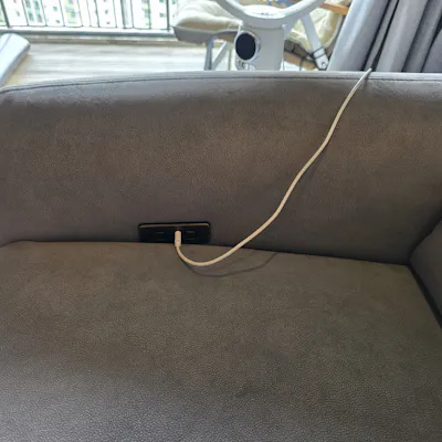 Customer home photo 1: Was able to arrange for sofa delivery within a week of ordering, thanks to ex stock availability. The fabric of the sofa feels comfortable, and material is definitely cooler than leather.
Had to replace my previous leather recliner due to a broken timber support and leather top coat flaking off badly, a typical problem for leather sofas in our humid climate.
Was a bit surprised with the dark grey colour of the sofa fabric as it gives off a bluish tint, when most of the furniture in my rooms are of warm and earth tones. The built-in USB A and C sockets are really convenient for charging devices.