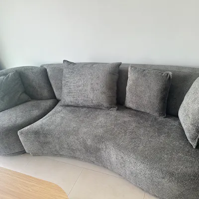 Customer home photo 3: Super comfy sofa, and the swivel chair is a unique and cool touch.