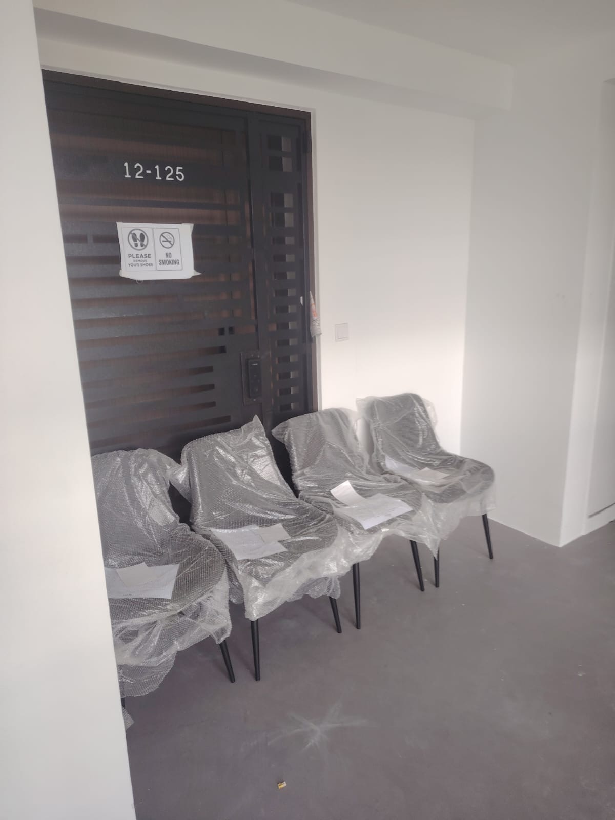 Customer home photo 1: Was late for delivery but deliver personnel assembled and placed it nicely outside the door. The chairs were great and comfortable. Strongly recommend.
