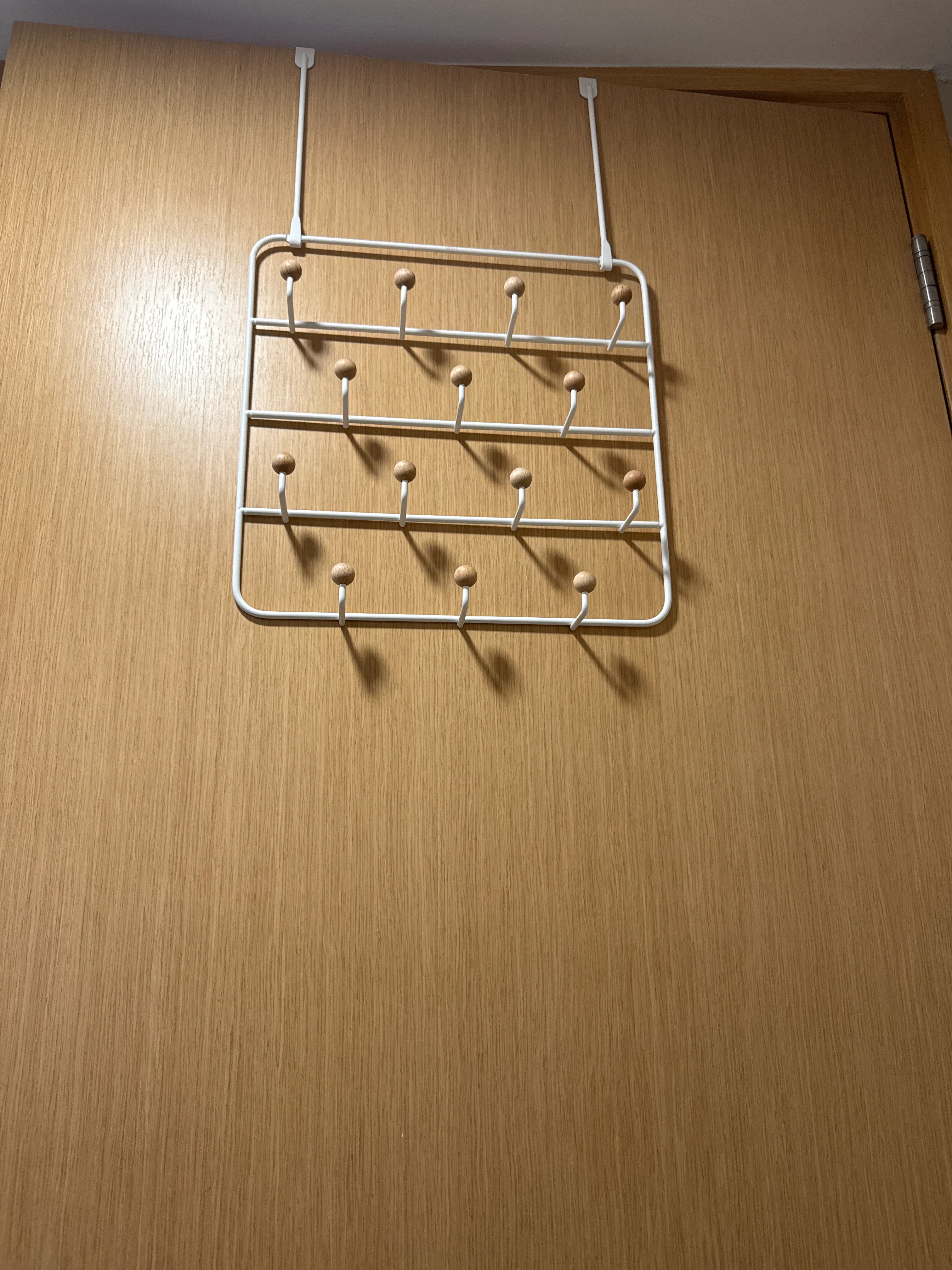 Customer home photo 1: New design than usual traditional ones for door organizer. Sturdy, sleek fit perfectly over the door and saves spaces. Simple to install and practical for everyday uses.