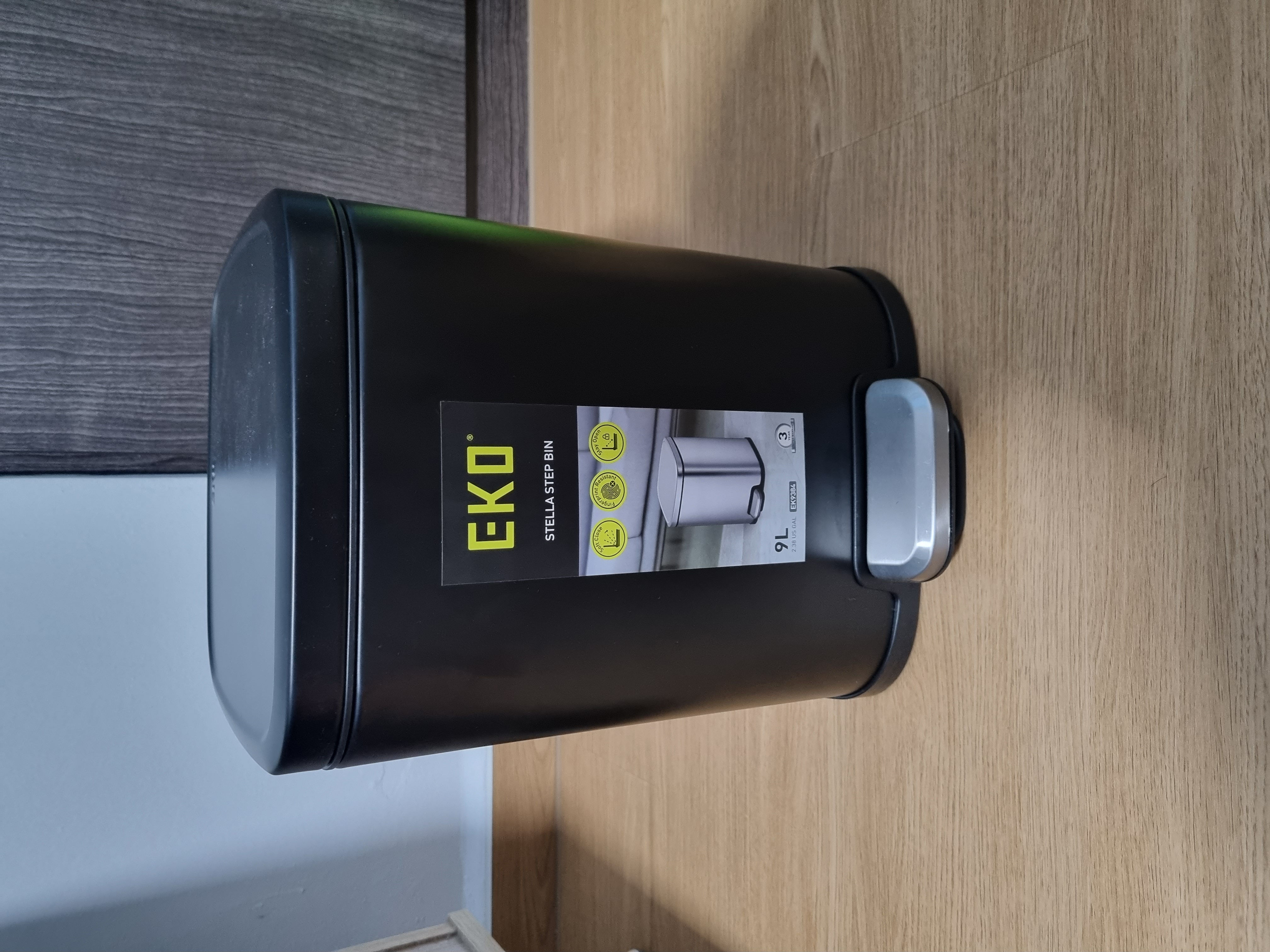 Customer home photo 2: Like this sleek bin, the squarish shaped. It functions well.