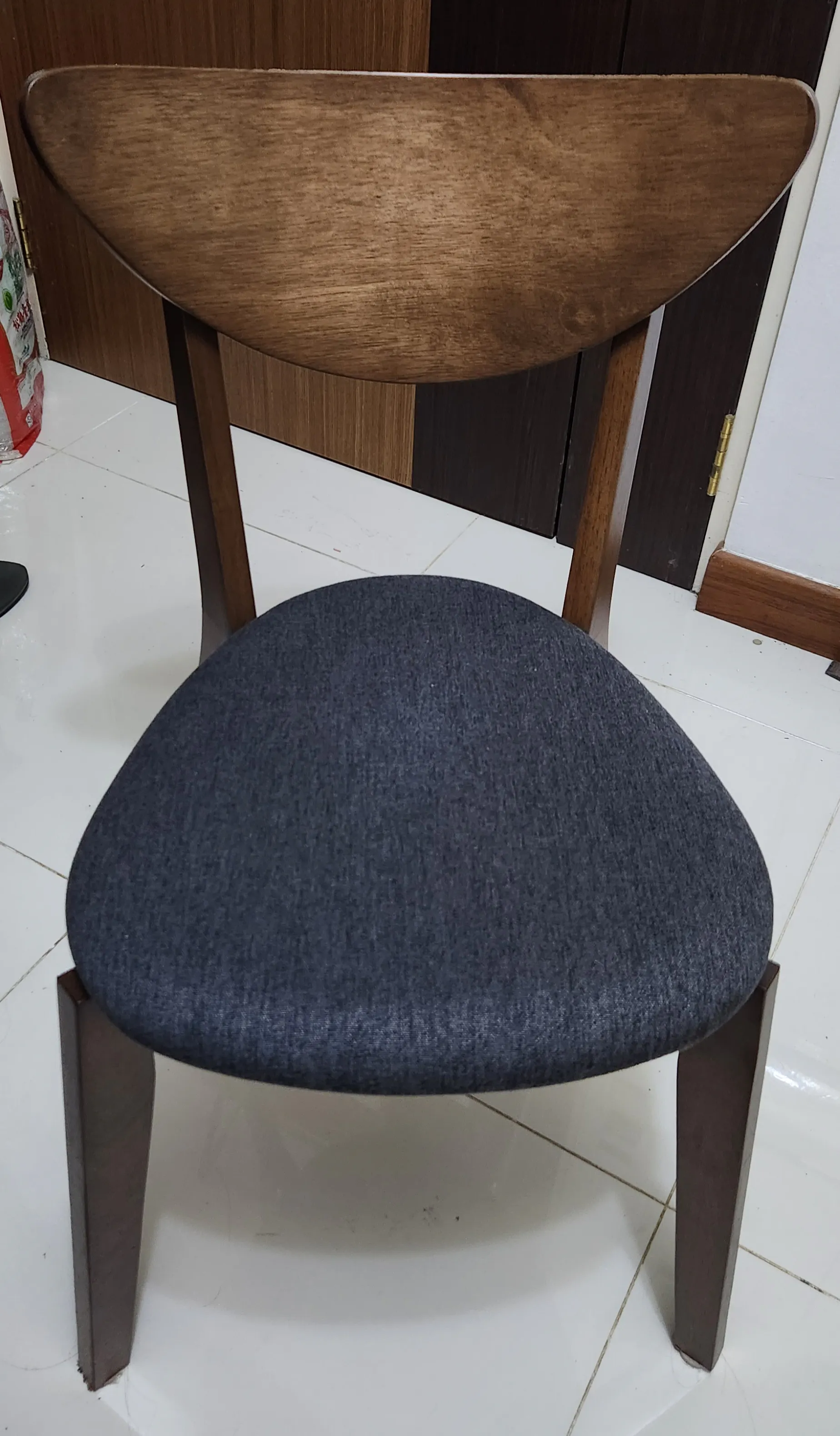 Customer home photo 33: Love the mix 'n' match combination where I can choose to opt for a chair instead of the bench so the family can lean back after a good meal. Chair is comfy and a good fit to the table.